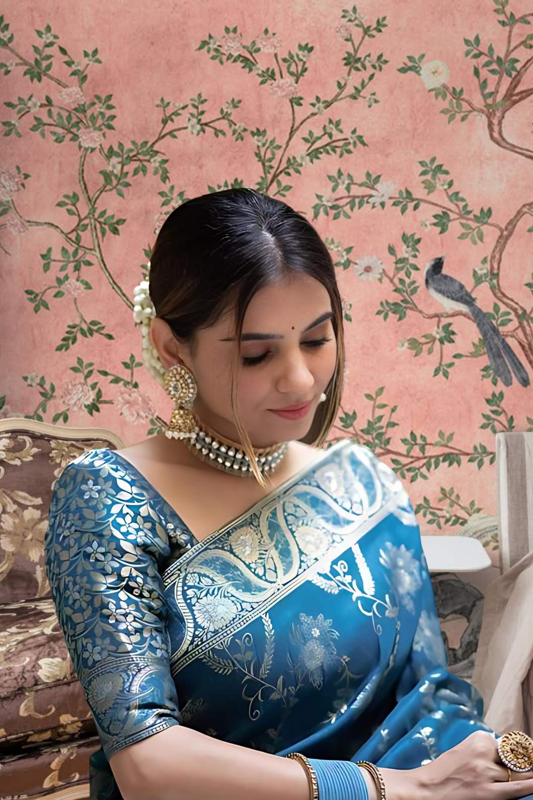 Front view showing Rama green silk saree glowing in palace lights