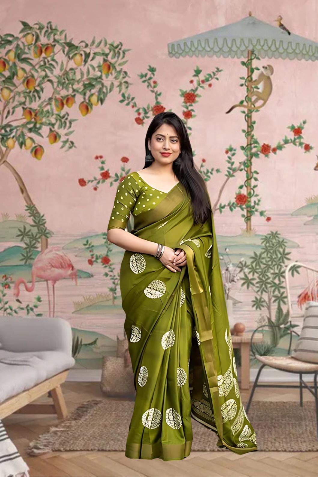 Front angle of green printed cotton crape saree glowing in regal palace light