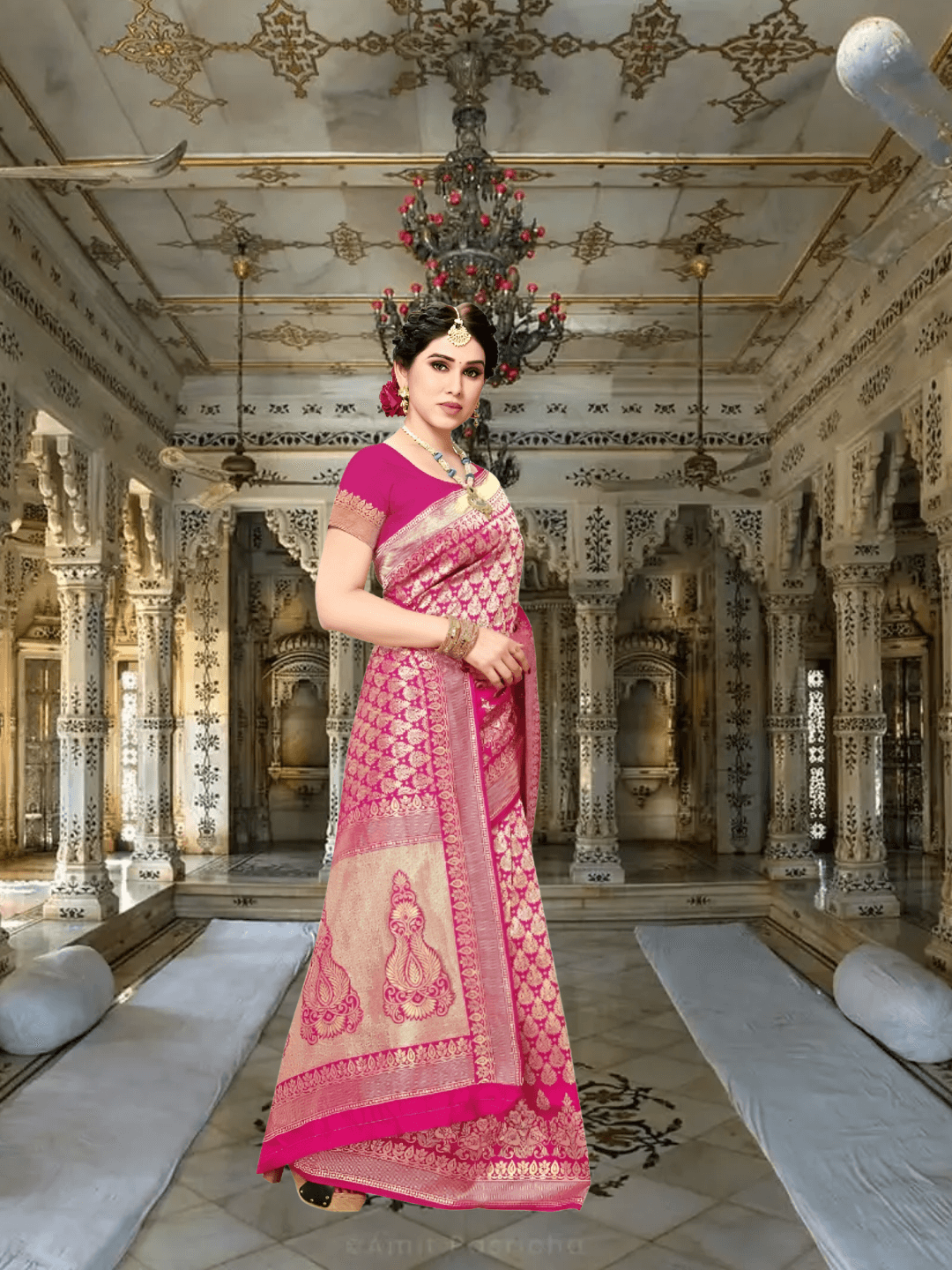 Border embroidery displayed like golden calligraphy flowing down the pleats