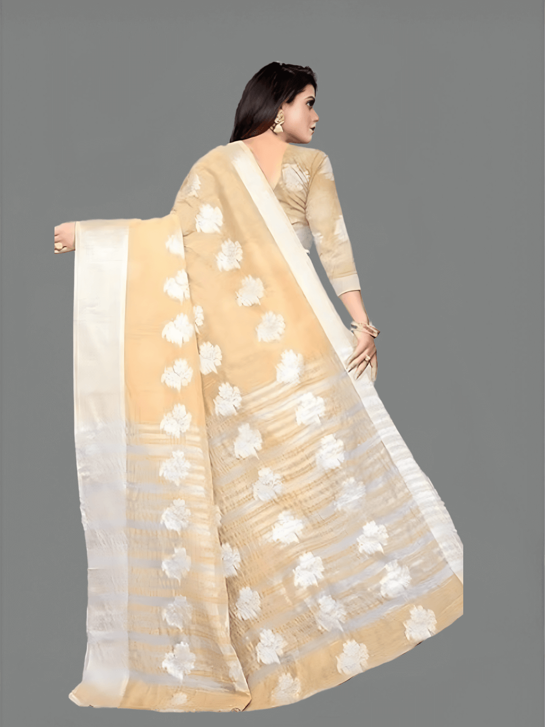 Beige saree styled with gold jewelry for evening weddings