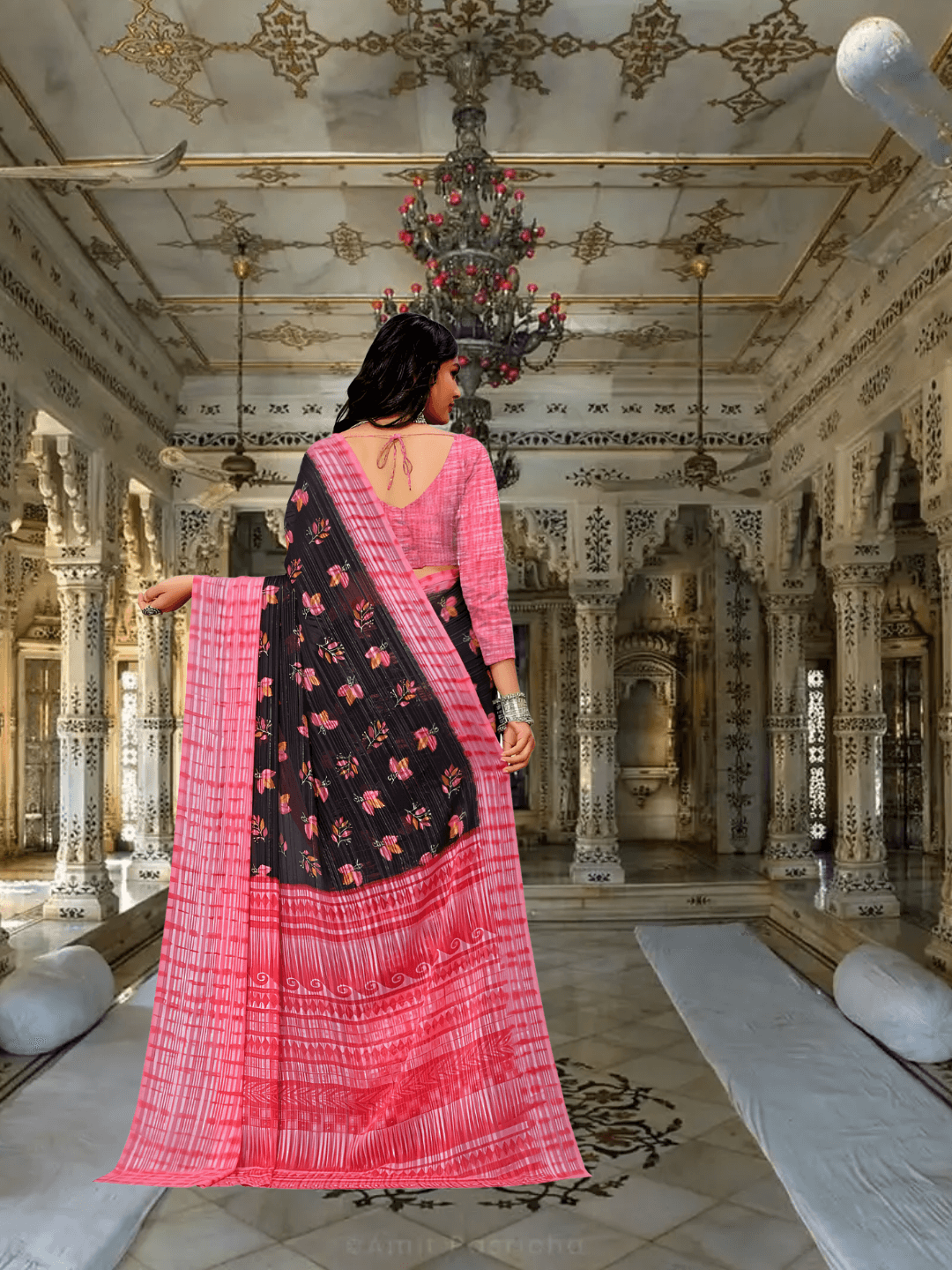 Model flipping pallu to reveal lace-like black patterns