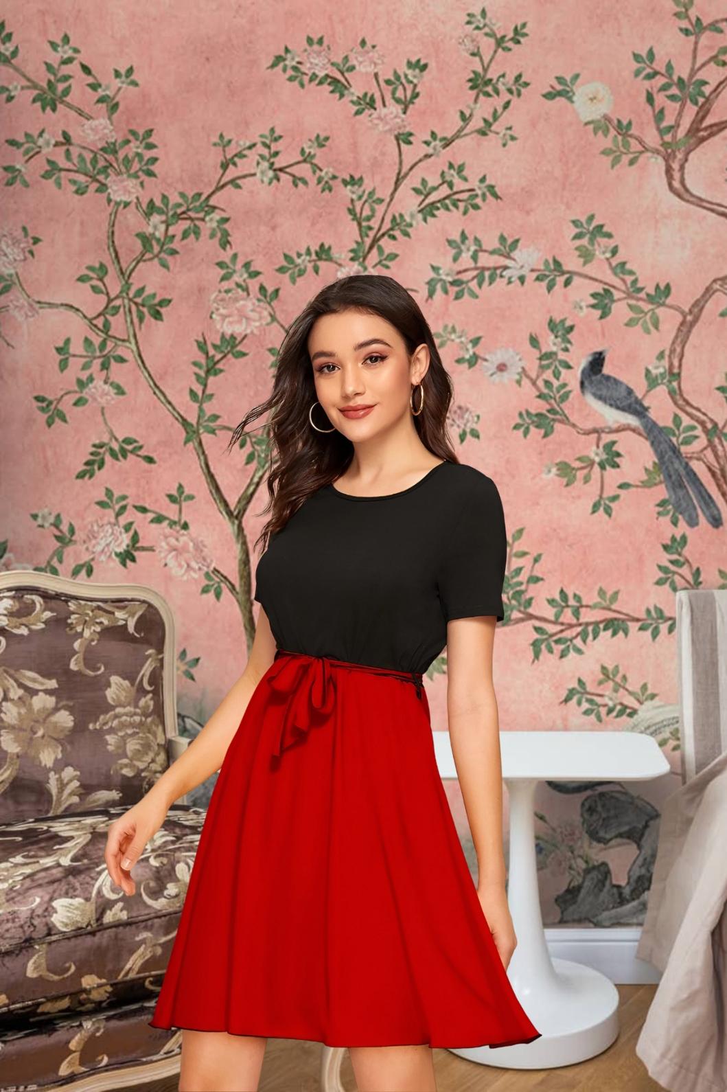 Model posing dramatically in The Carmine Waltz against elegant backdrop