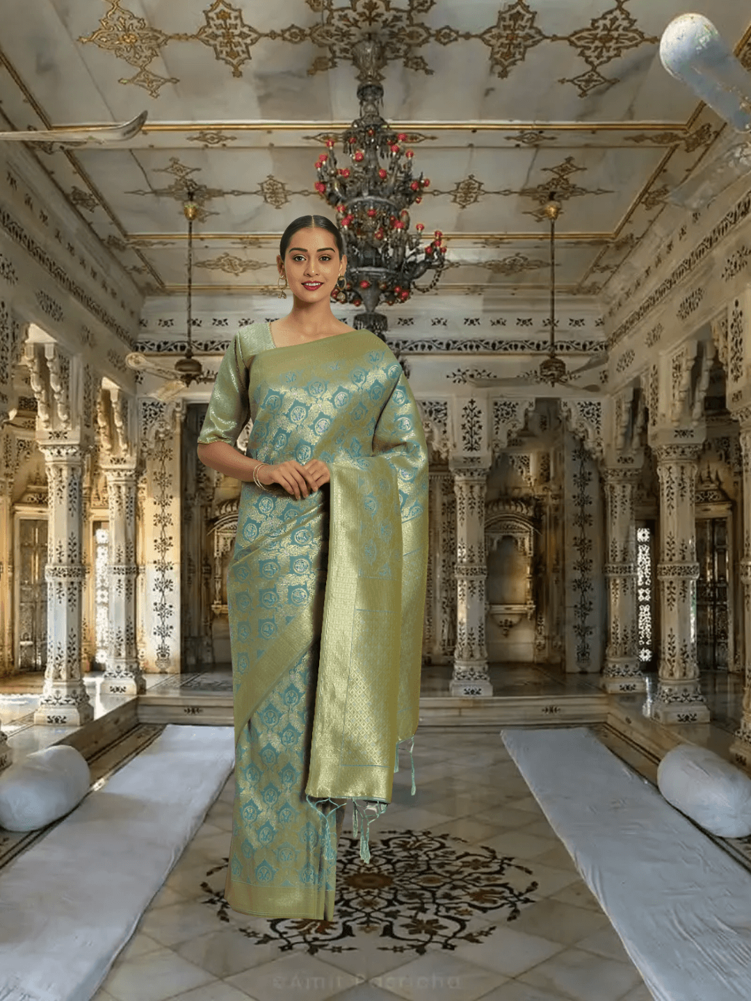 Model wearing pista green Banarasi silk saree with gold border in palace setting