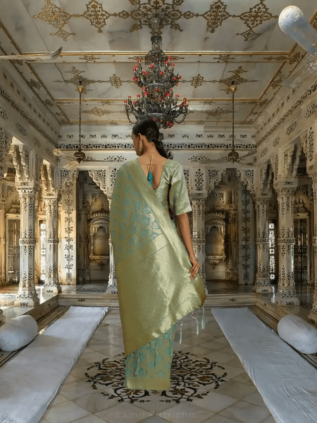 Detailed pallu view of pista green saree with rich gold weave