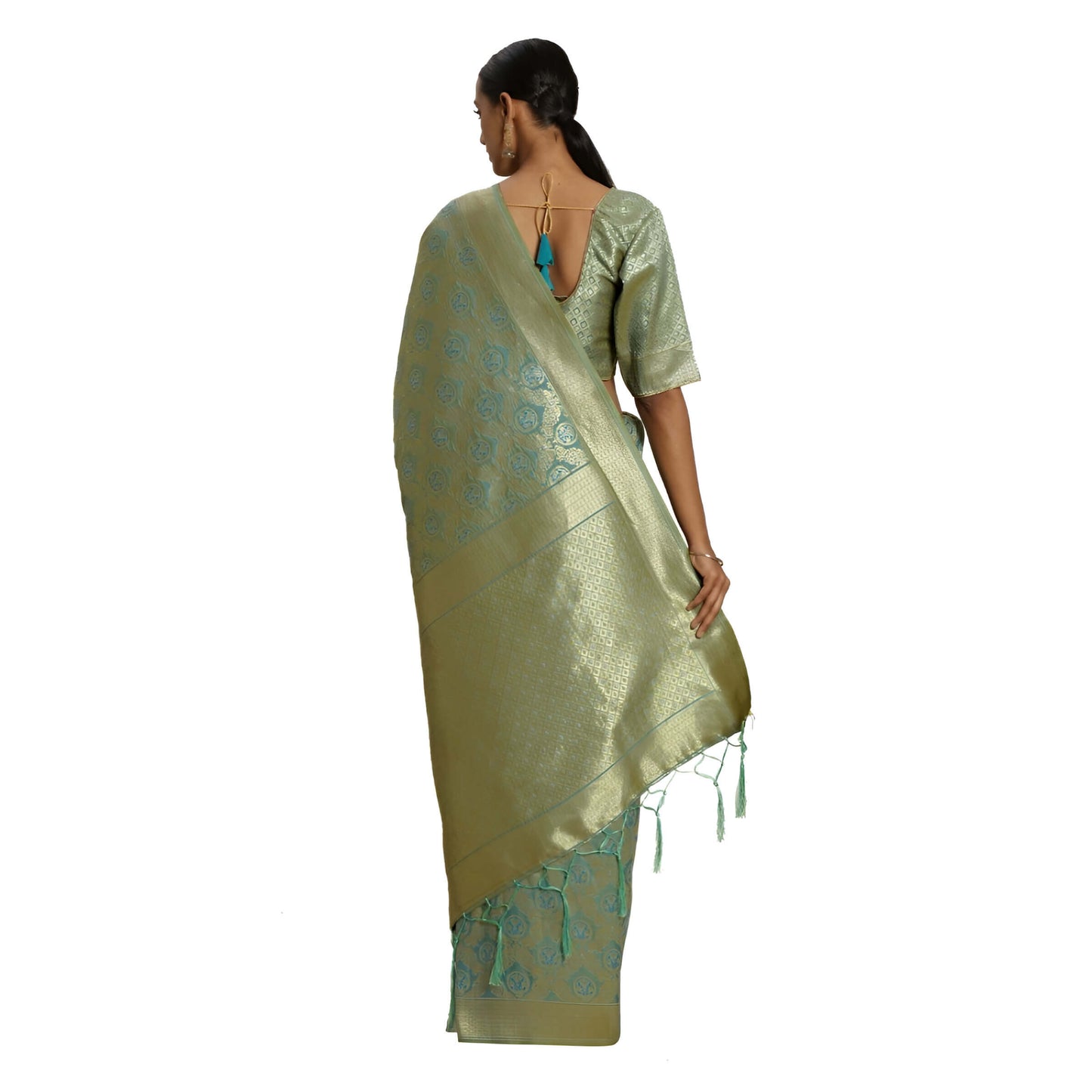 Golden pallu of pista green saree glistening against white backdrop