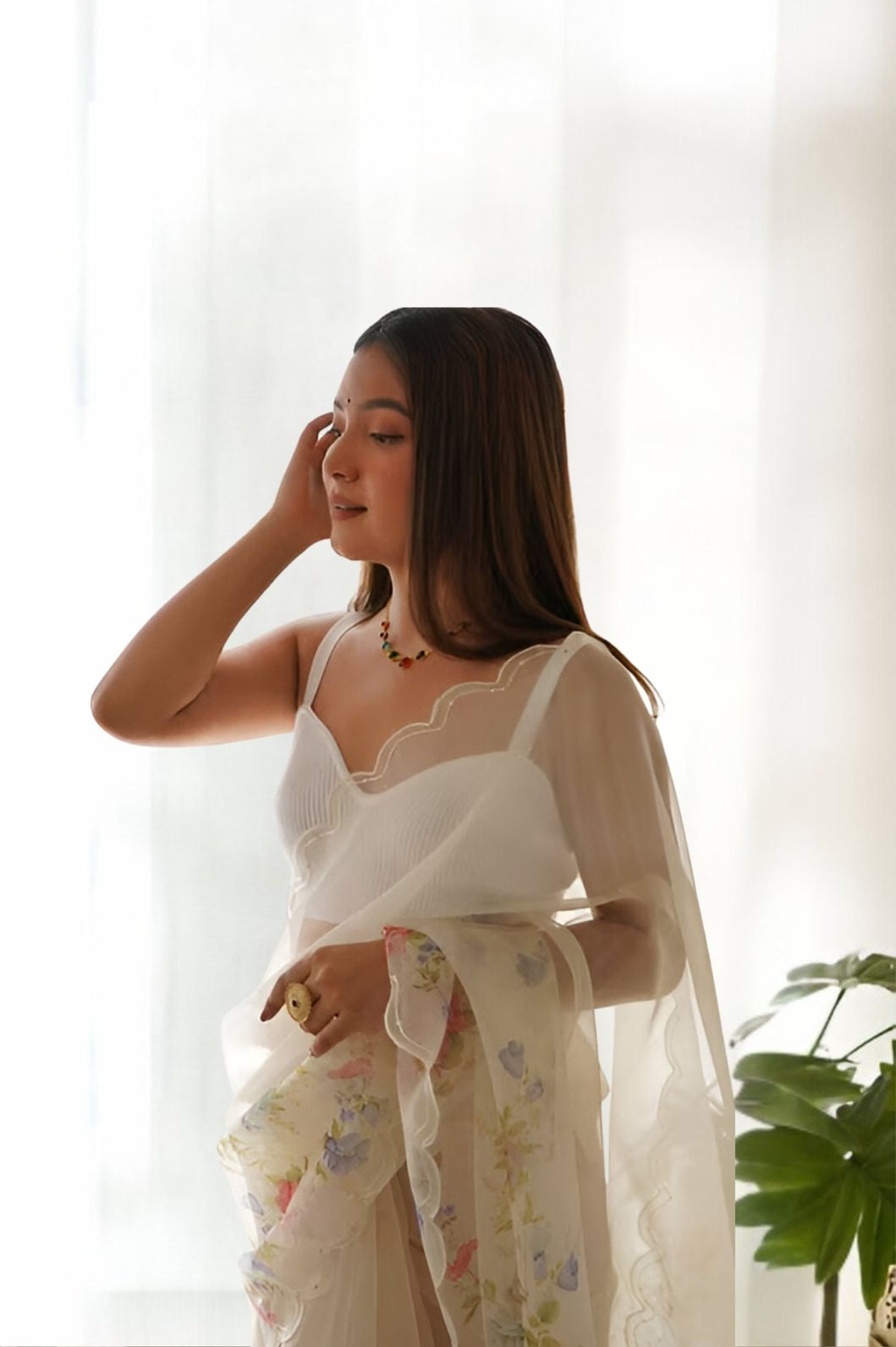 Close-up of floral pattern on white organza fabric