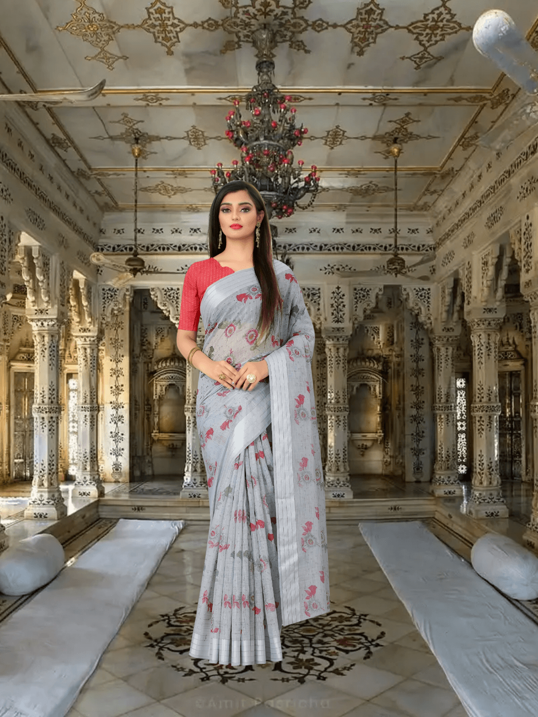 Model standing in royal room draped in simple grey cotton saree with calm expression