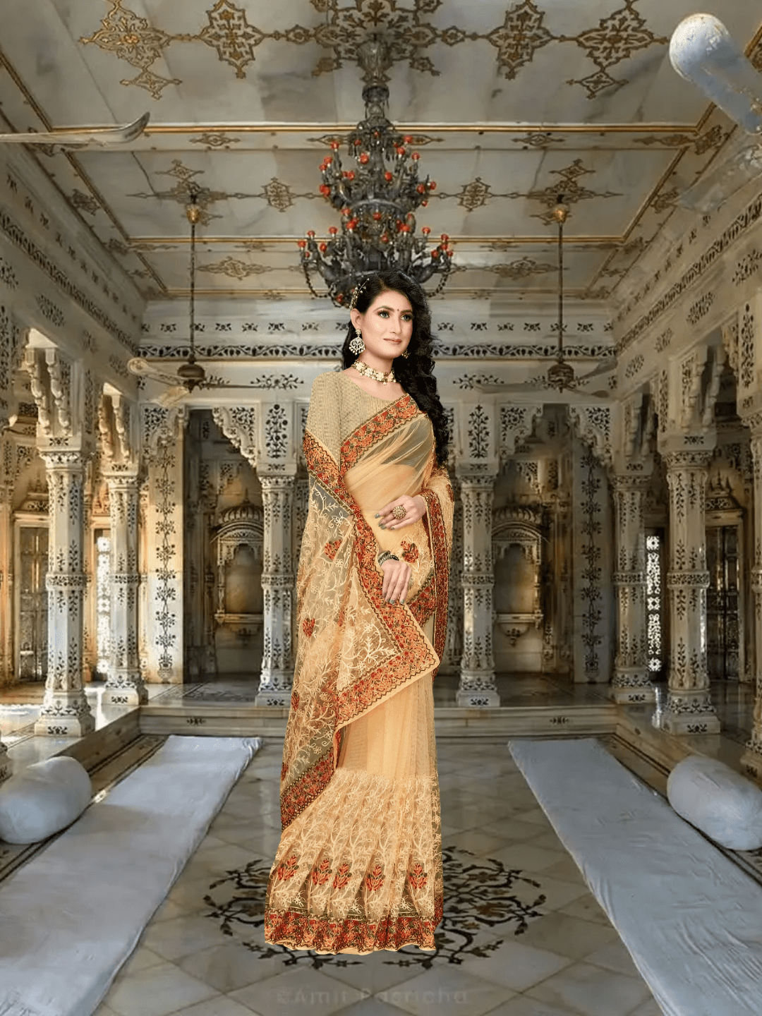 Sheer cream net saree glowing under palace torches, embroidery casting lace shadows