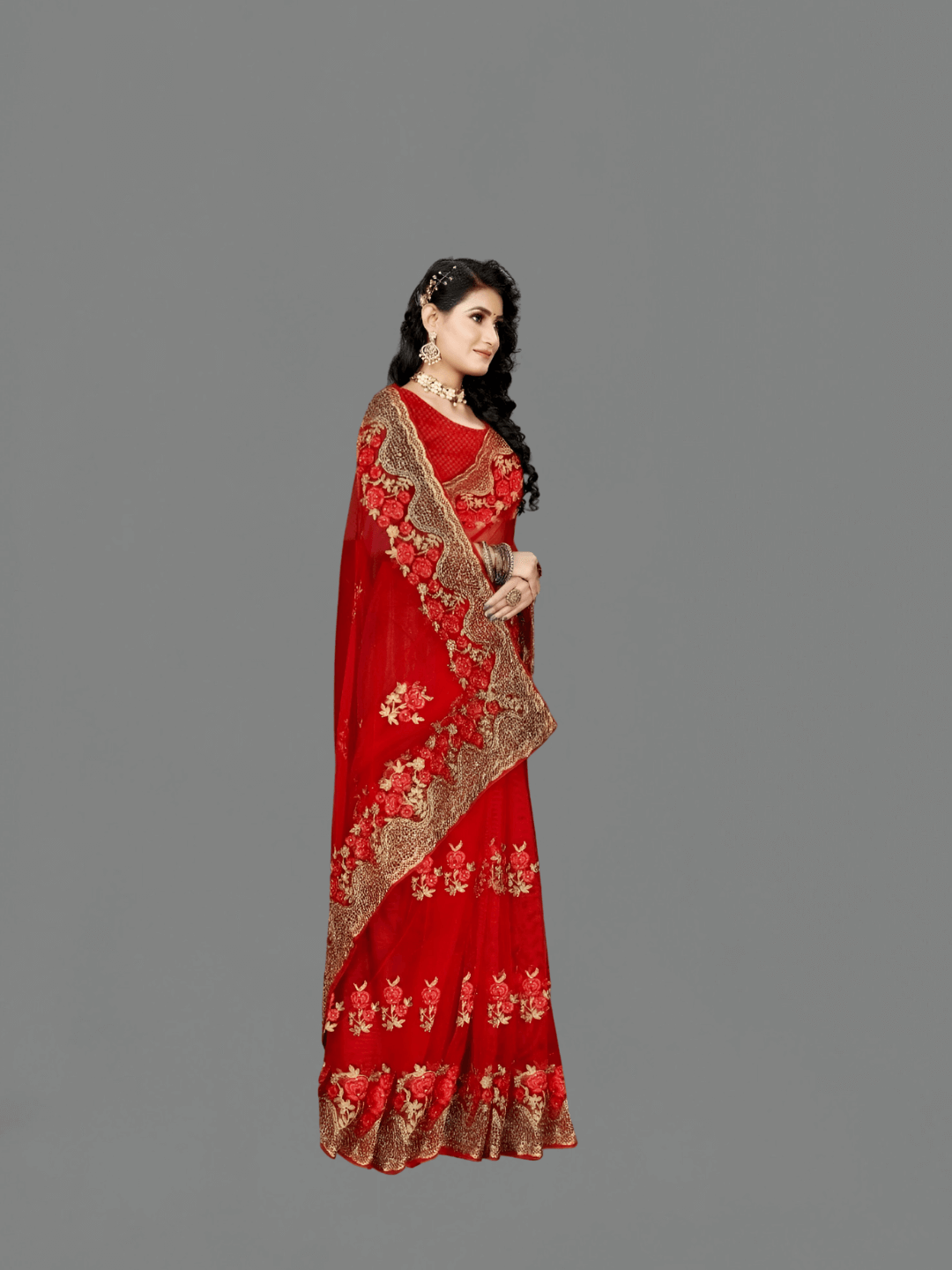 Red net saree flat lay on grey slate, gold motifs placed like a jeweler’s final draft