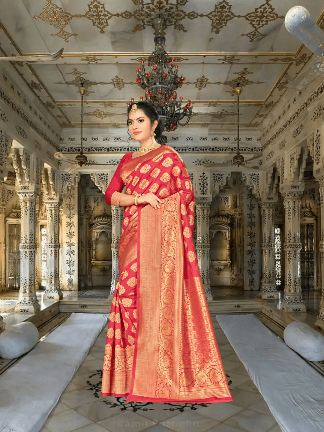 Detailed close-up of gold zari border work on deep wine Banarasi silk saree