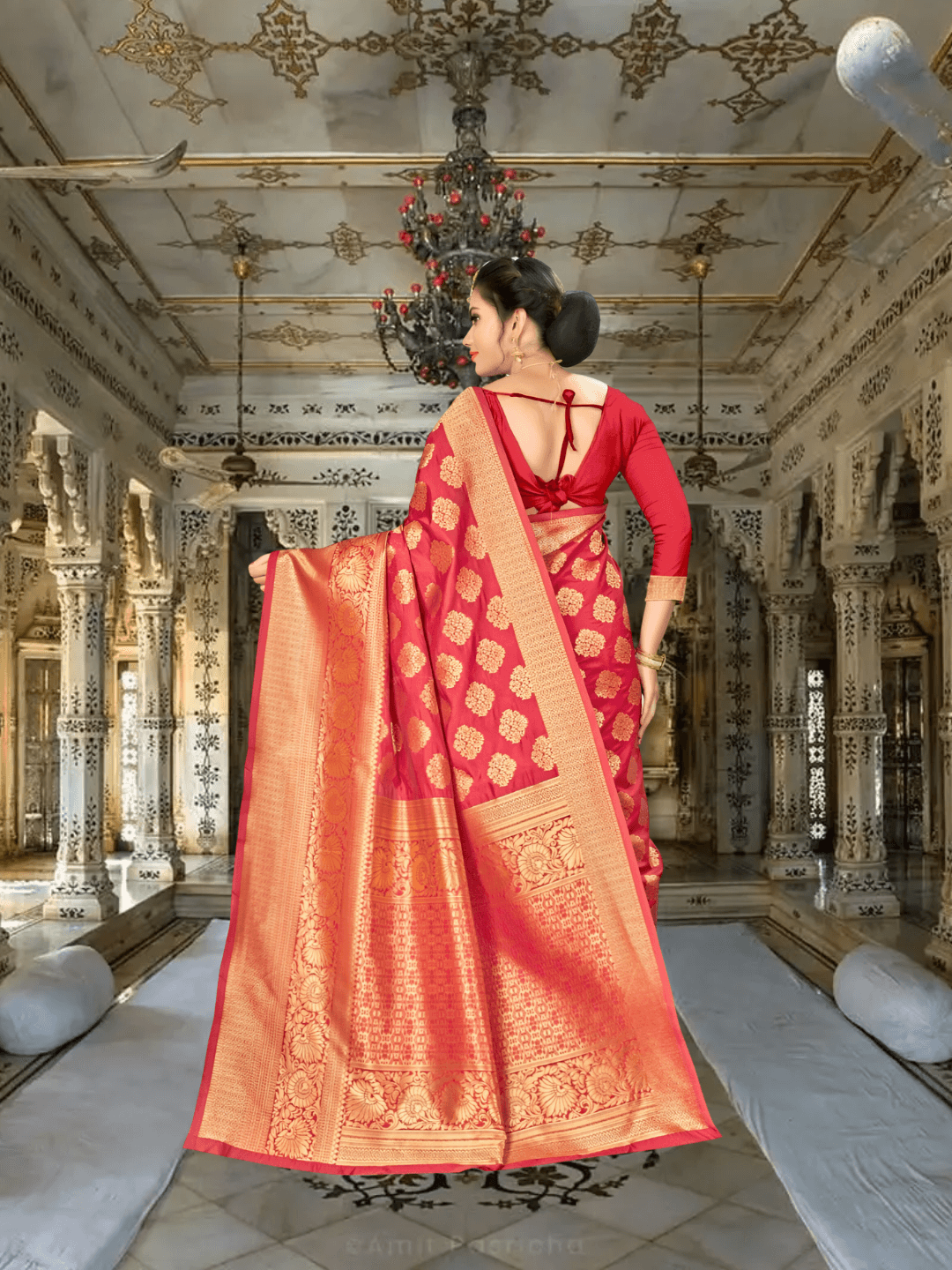 Graceful pallu of red-gold Banarasi silk saree flowing over shoulder in palace backdrop