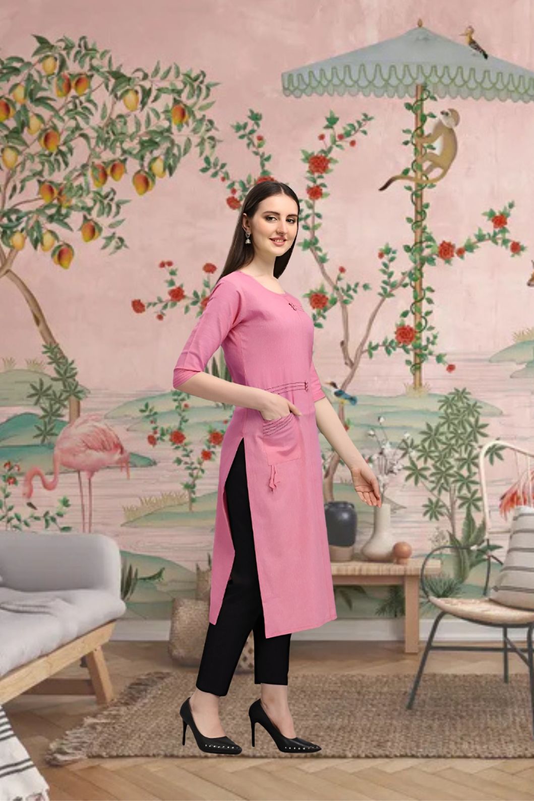 Side angle of straight pink kurti styled in traditional backdrop