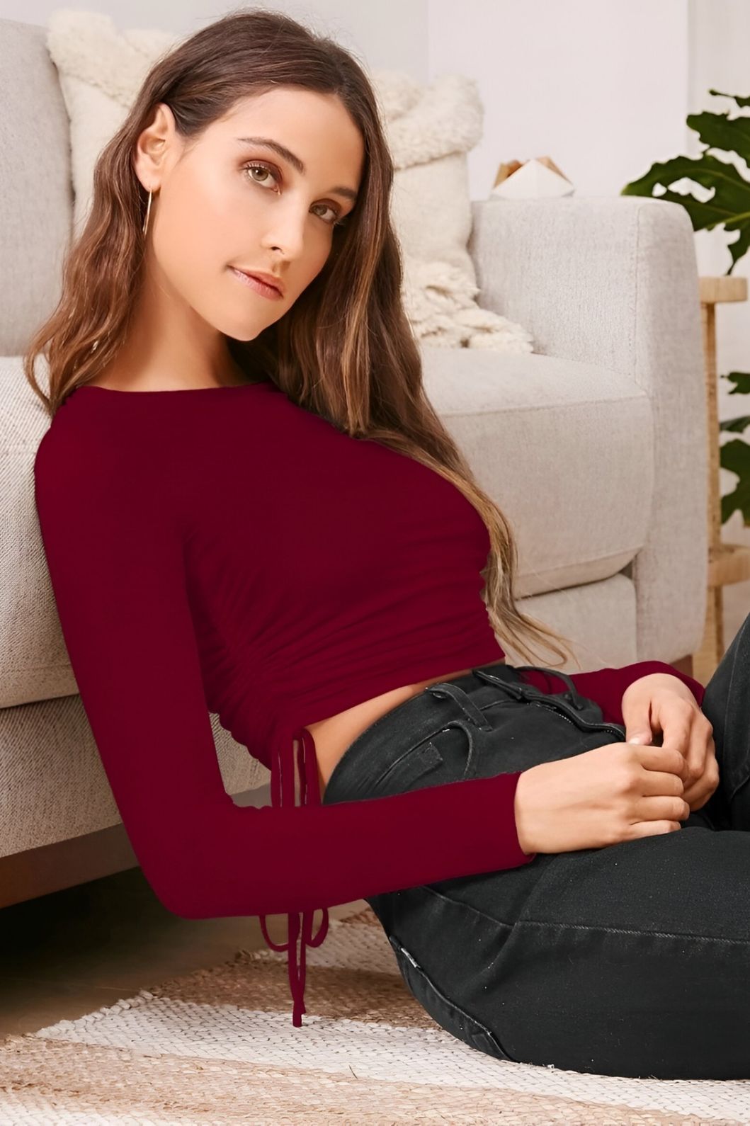 Left side pose of maroon round neck CELESTINA top