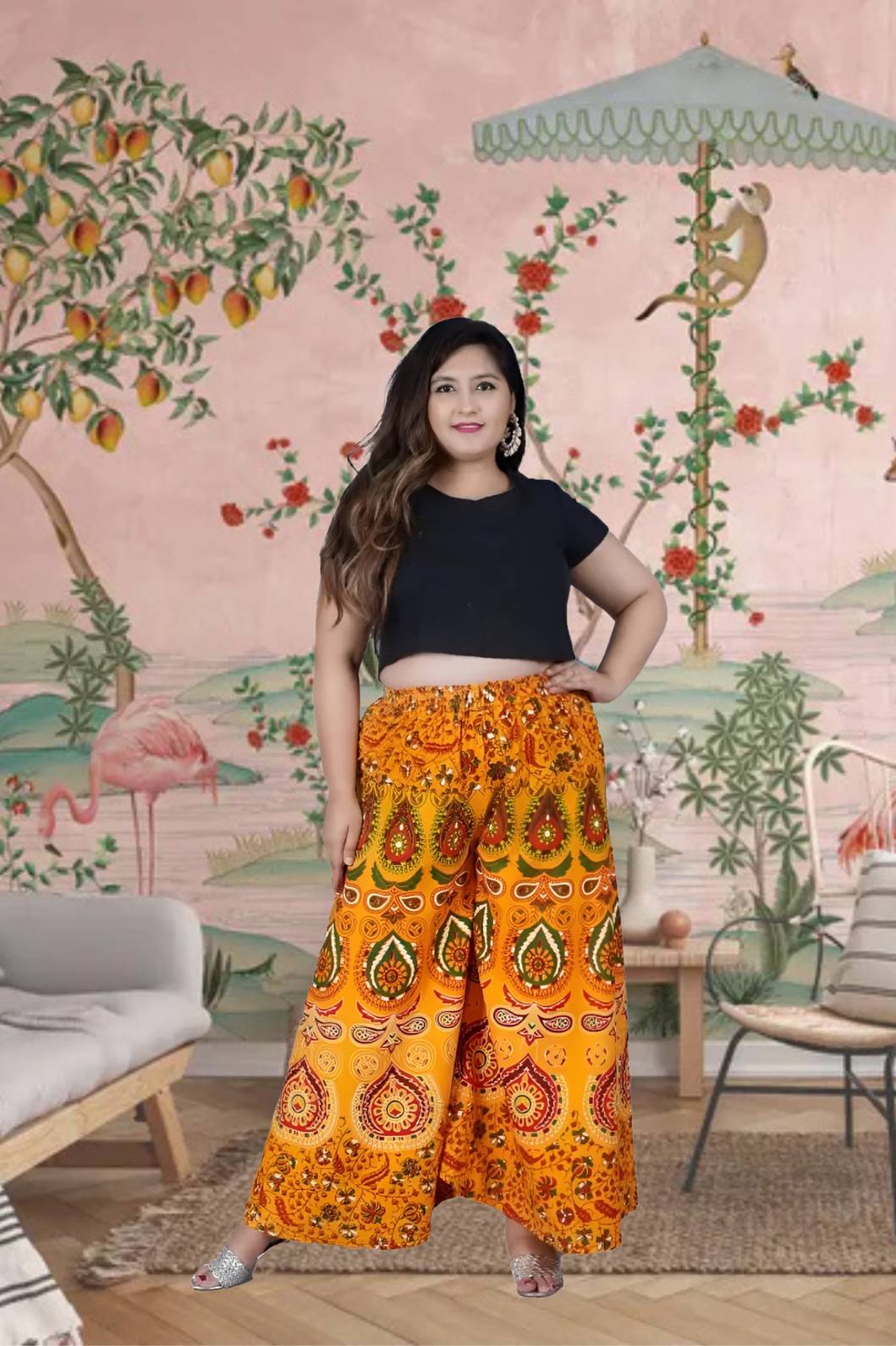 Front view of yellow Jaipur print palazzo pant in royal setting