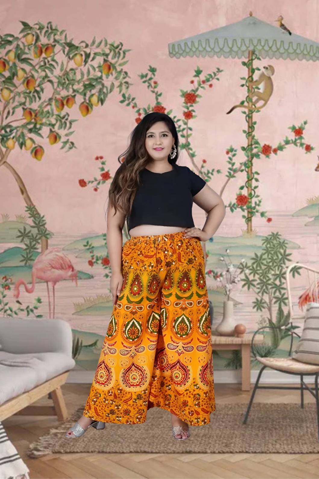 Front view of yellow Jaipur print palazzo pant in royal setting