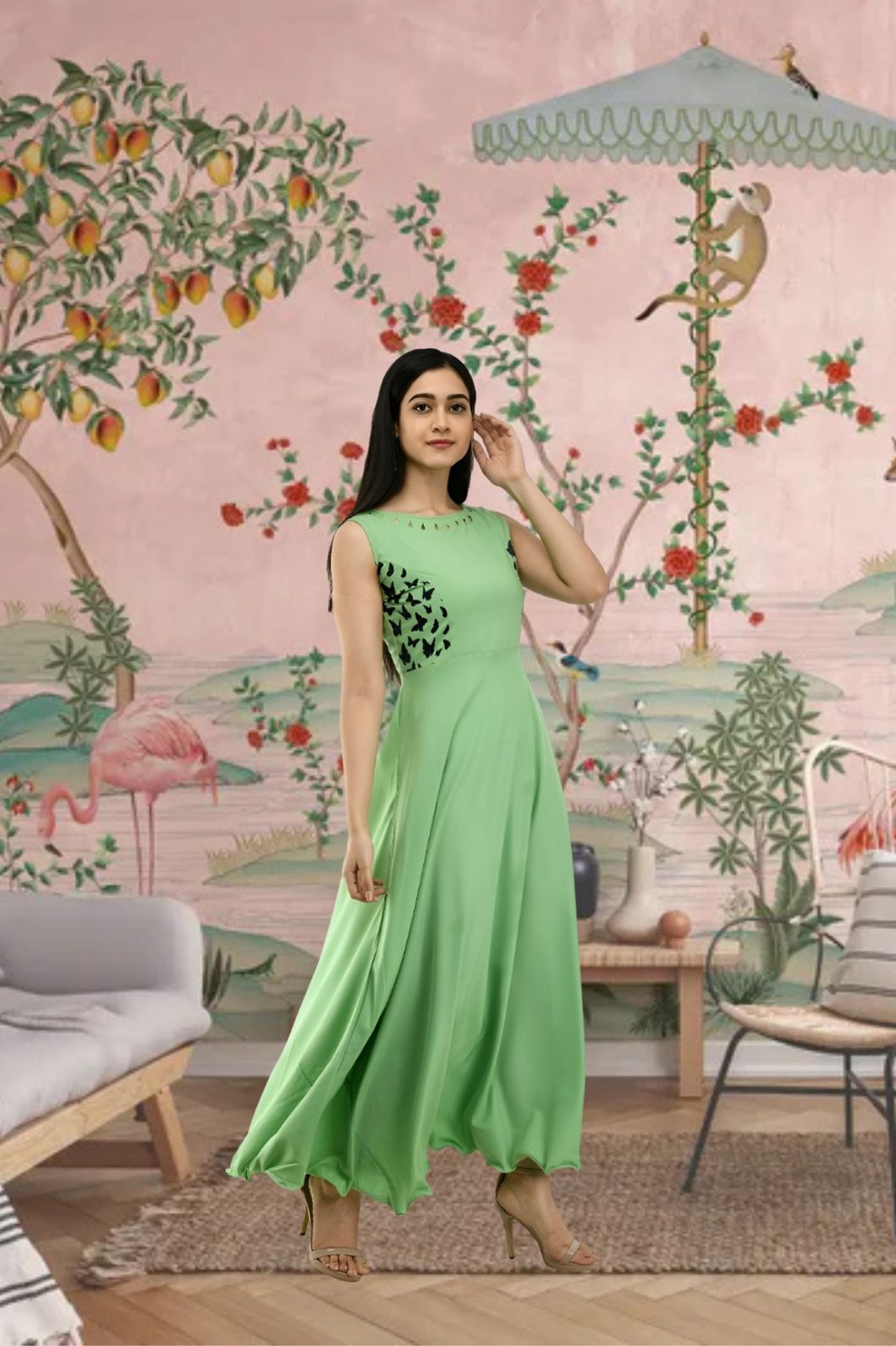 Front view of sleeveless green full-length crepe gown in palace setting