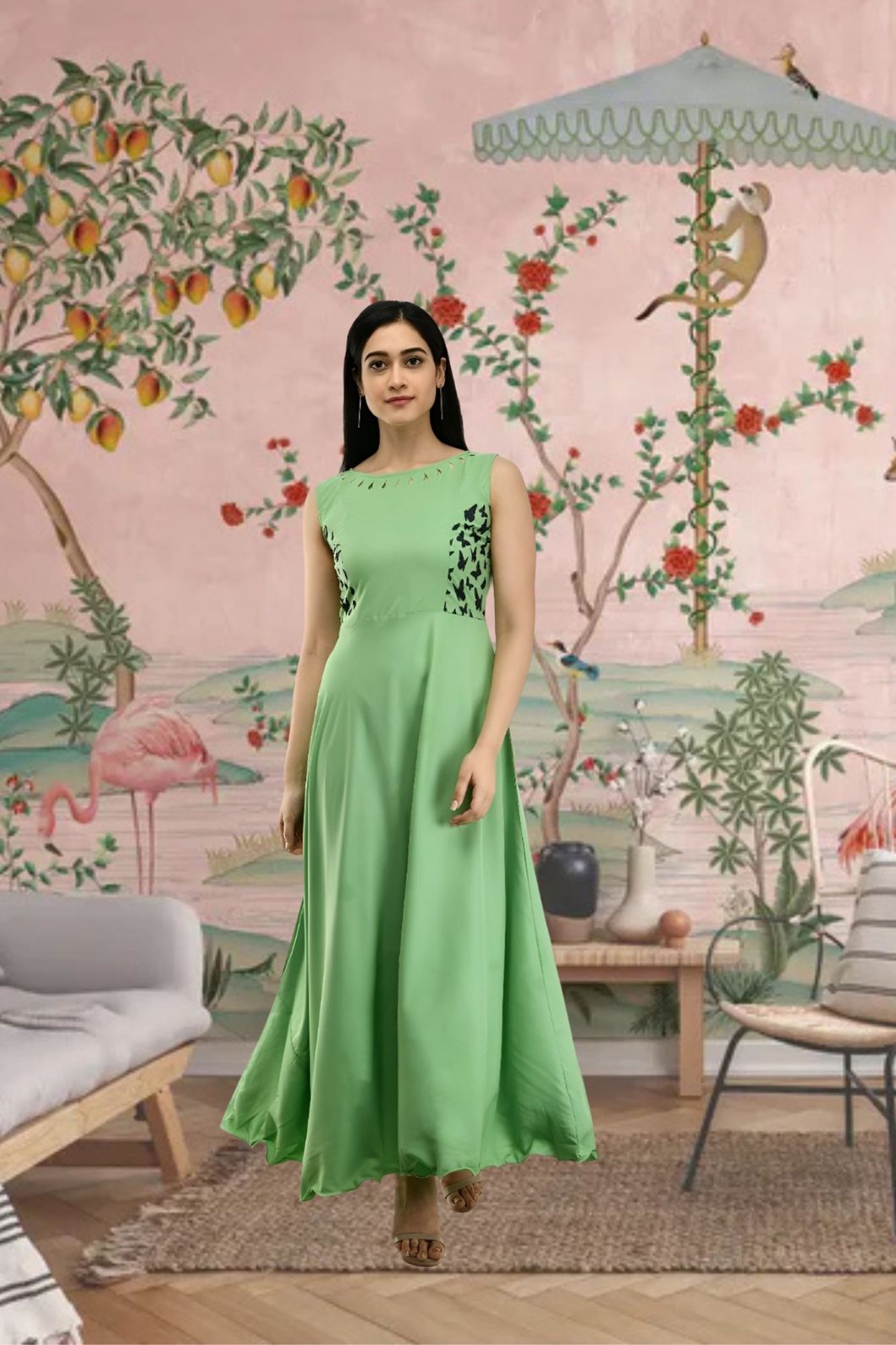Front view of sleeveless green full-length crepe gown in palace setting