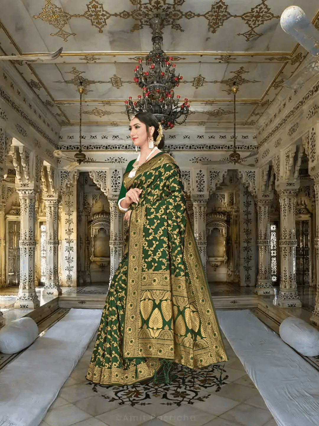 Model walking in deep green Banarasi saree under palace chandeliers