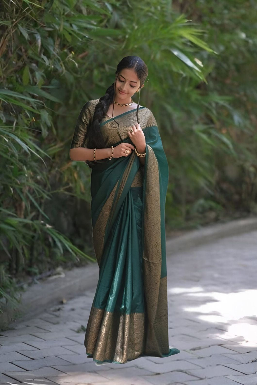 Front view of π Hiranyasnehi green Lichi silk saree draped gracefully β lifestyle background