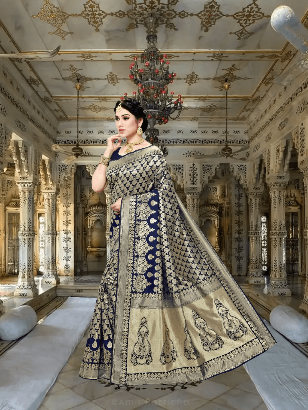 Navy blue saree glowing beneath royal chandeliers, golden jacquard patterns adding regal charm