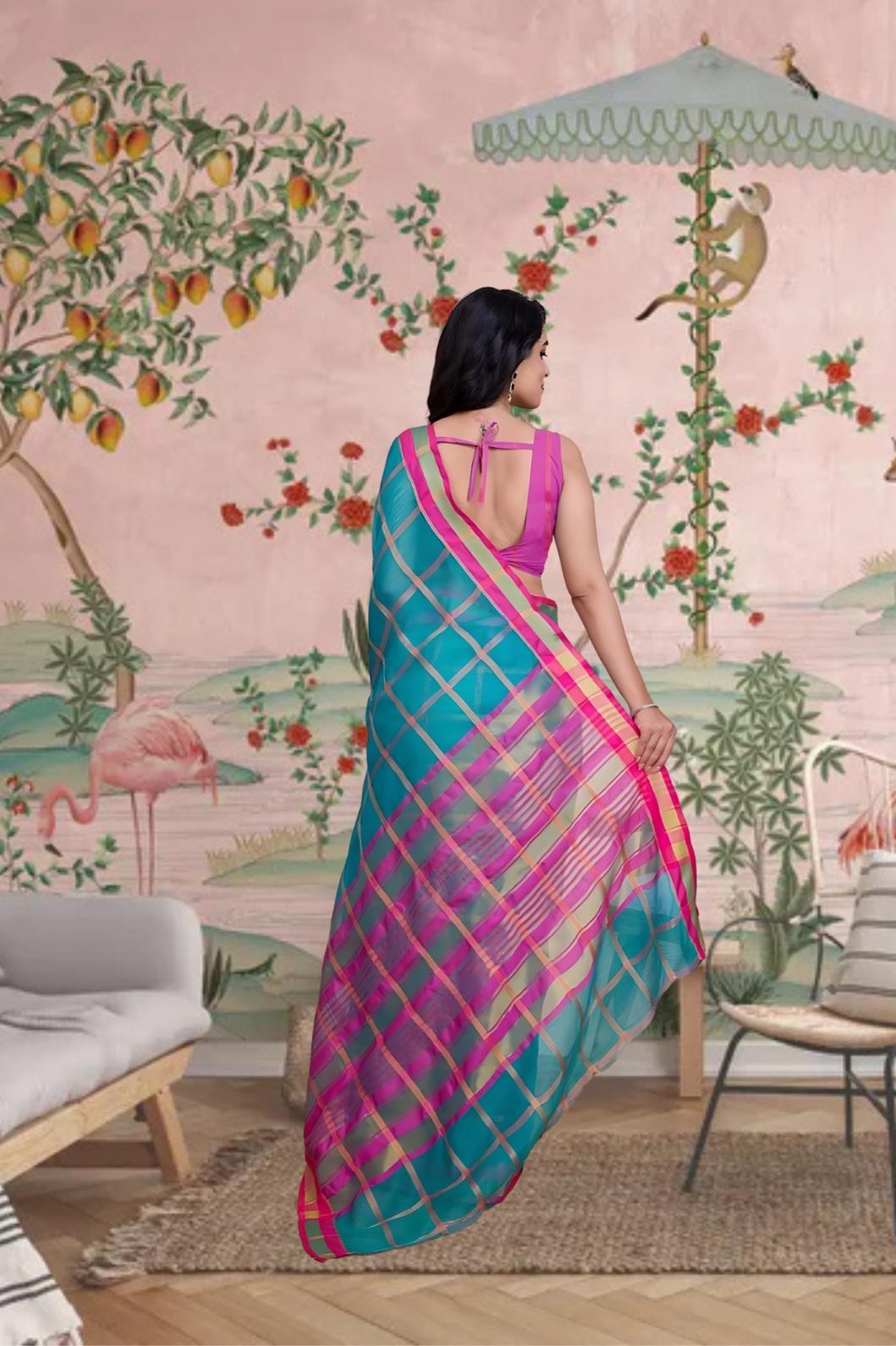Rear profile showing flowing pallu with fine checks and heritage tone