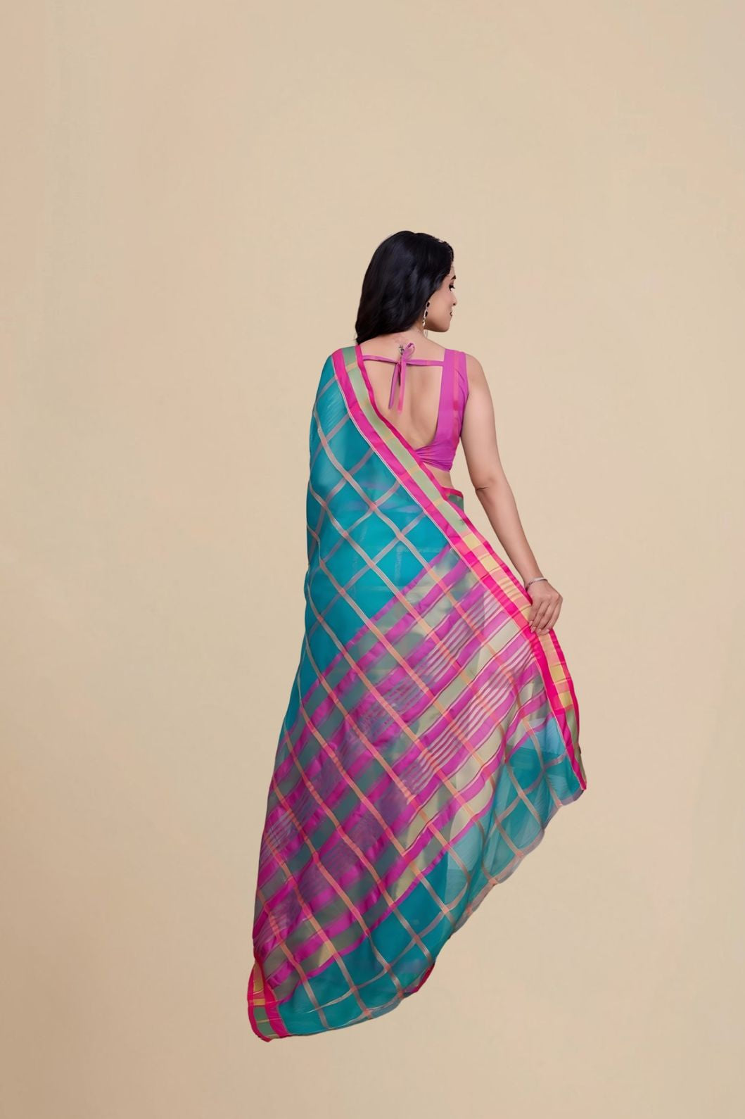 Studio rear view highlighting unstitched blouse and pallu shape