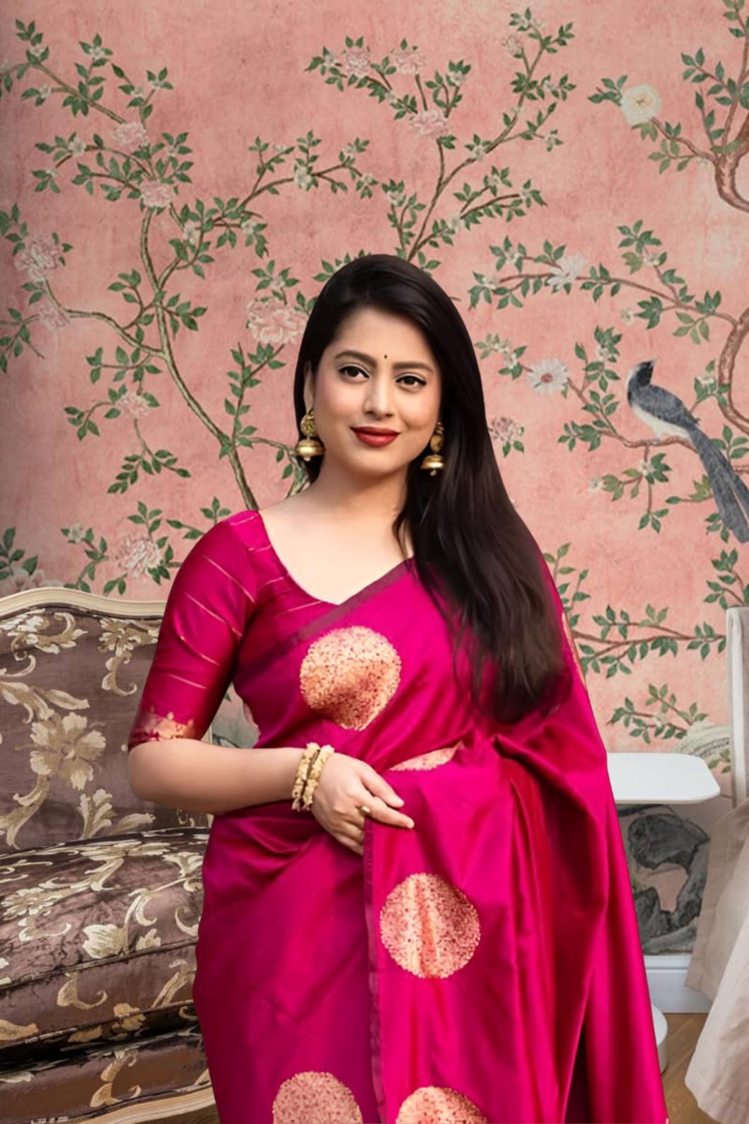 Front view of pink silk printed saree in royal setting