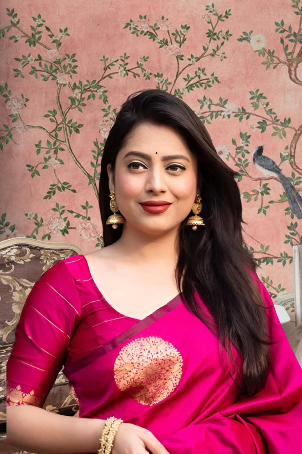 Front view of pink silk printed saree in royal setting