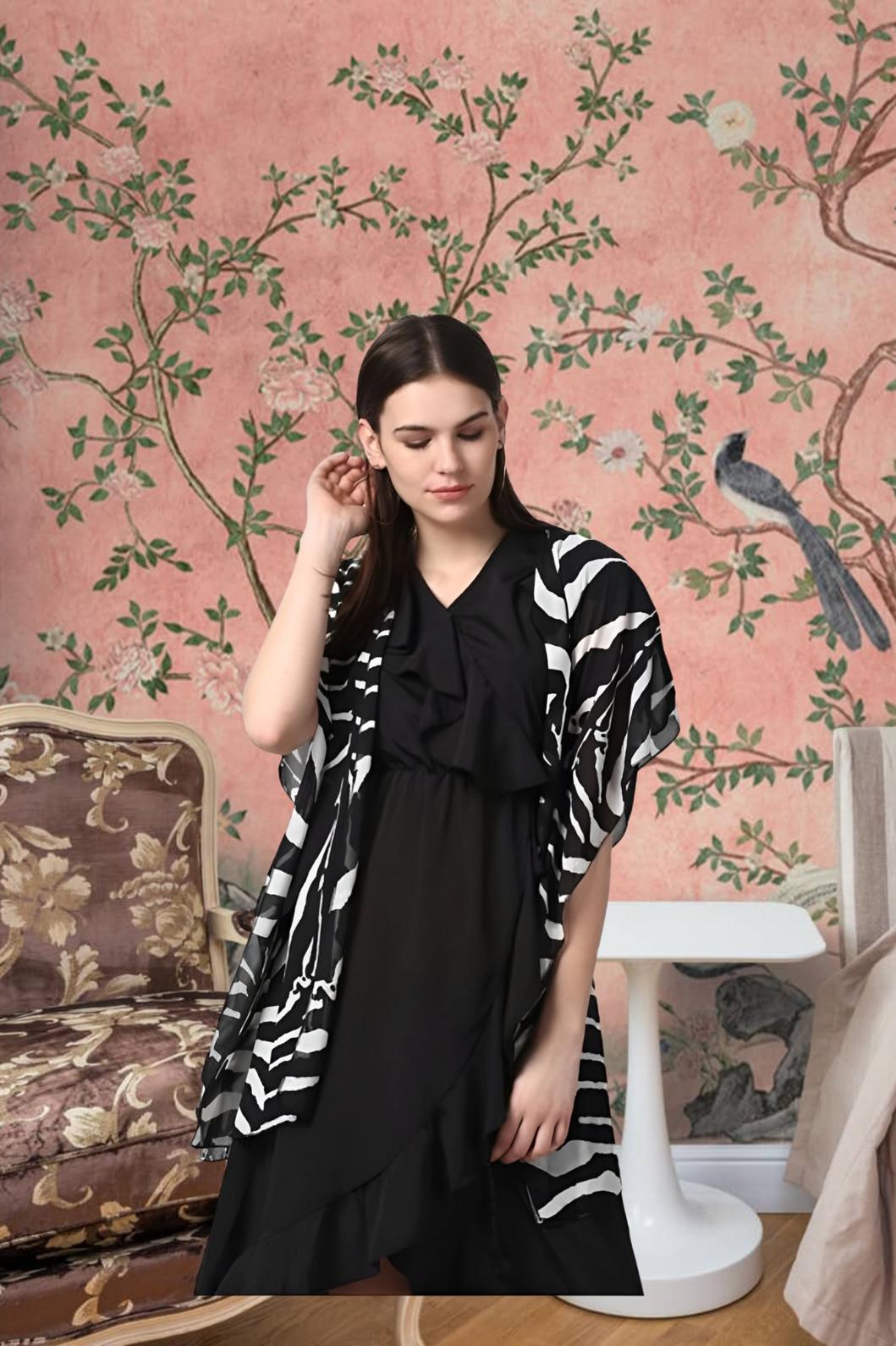 Front view of black printed women’s shrug by CELESTINA