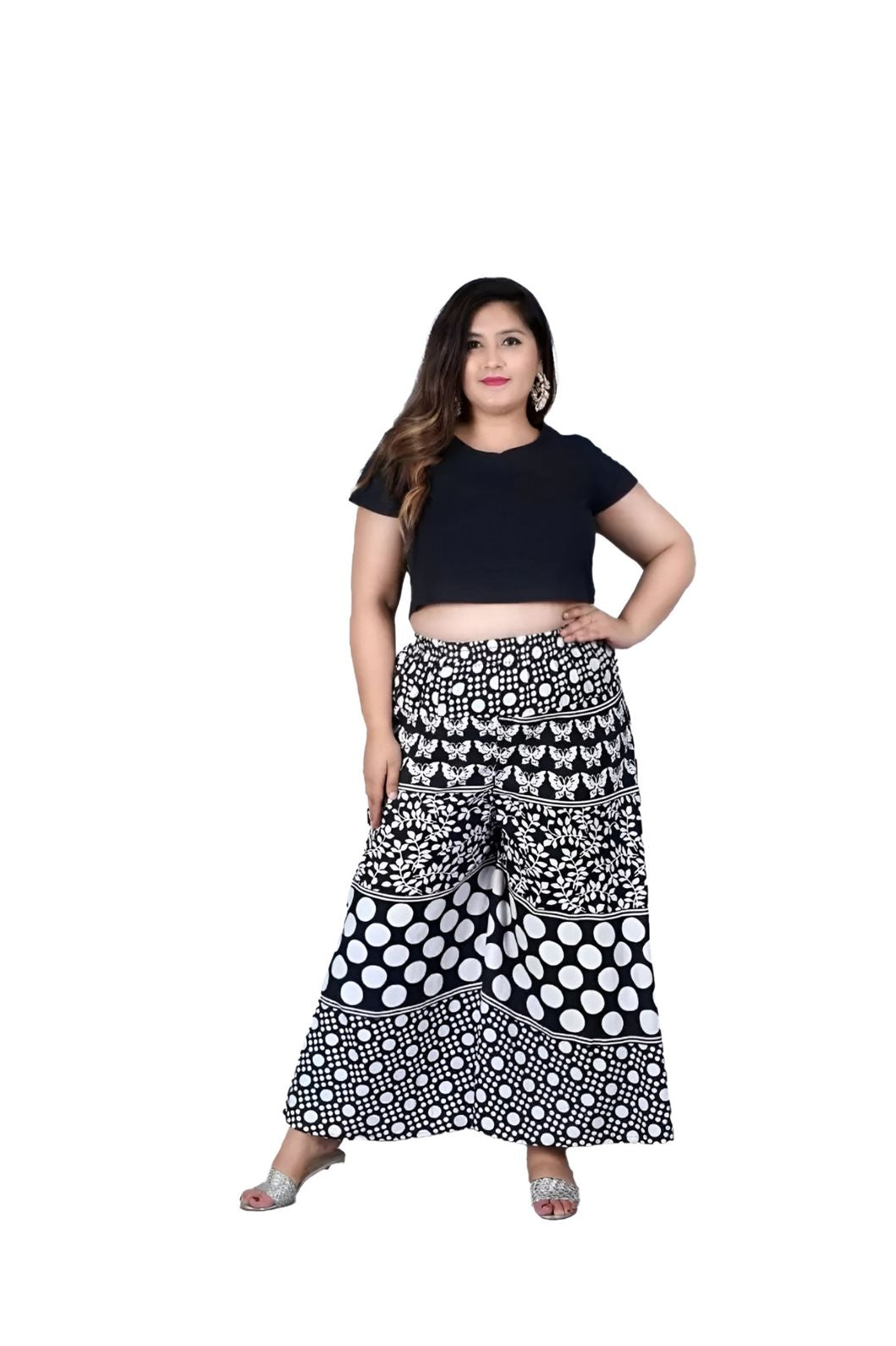 Front angle of printed black palazzo pants in isolation