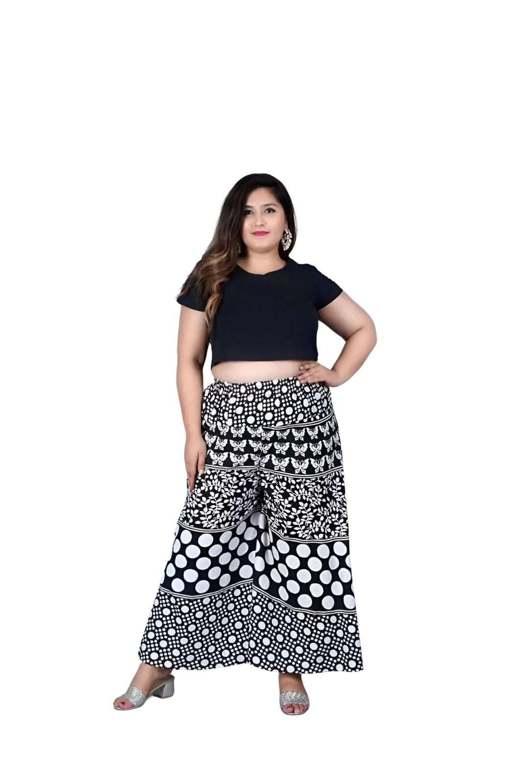 Front angle of printed black palazzo pants in isolation