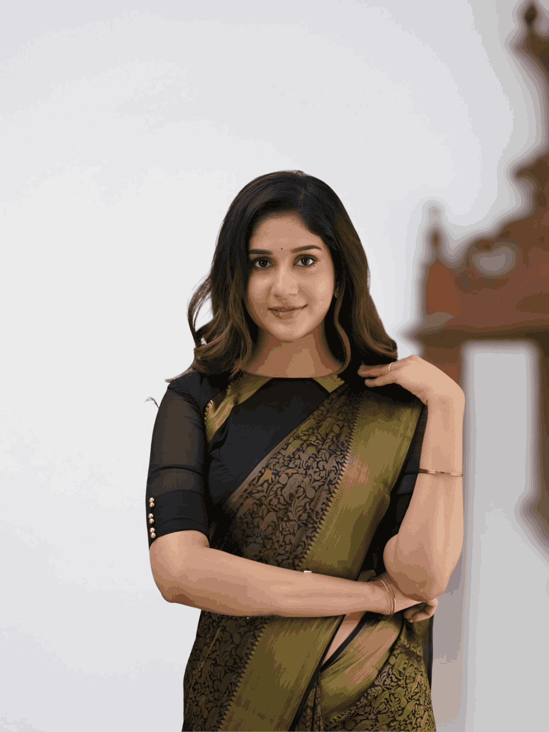 Model in dramatic pose, black silk cascading with printed details