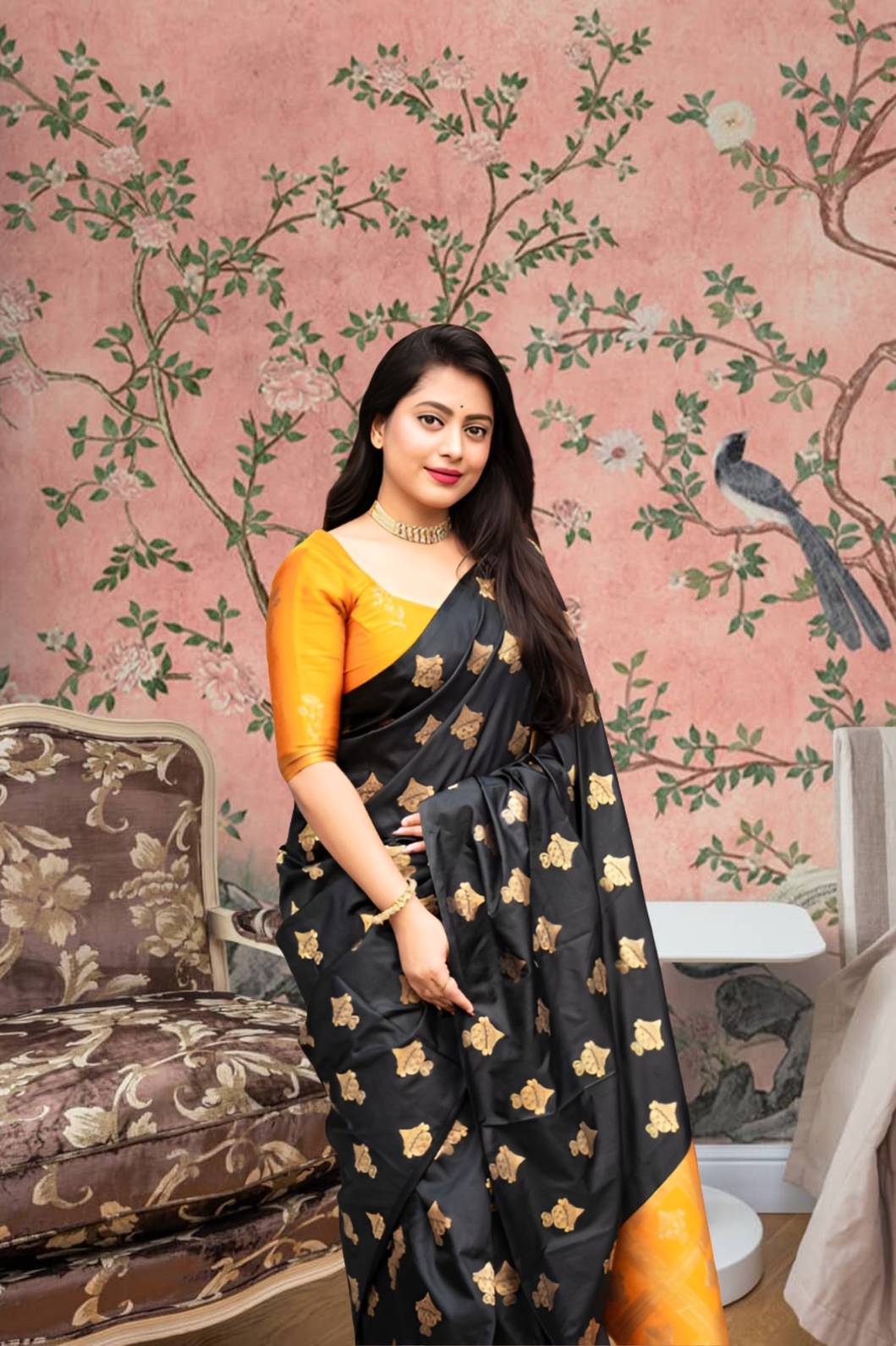 Front view of black silk saree with vibrant yellow blouse in royal palace room
