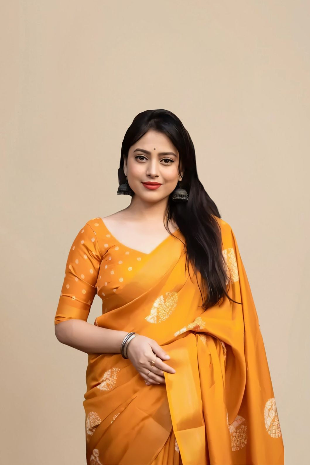 Studio front view of yellow saree showing print and elegant shape
