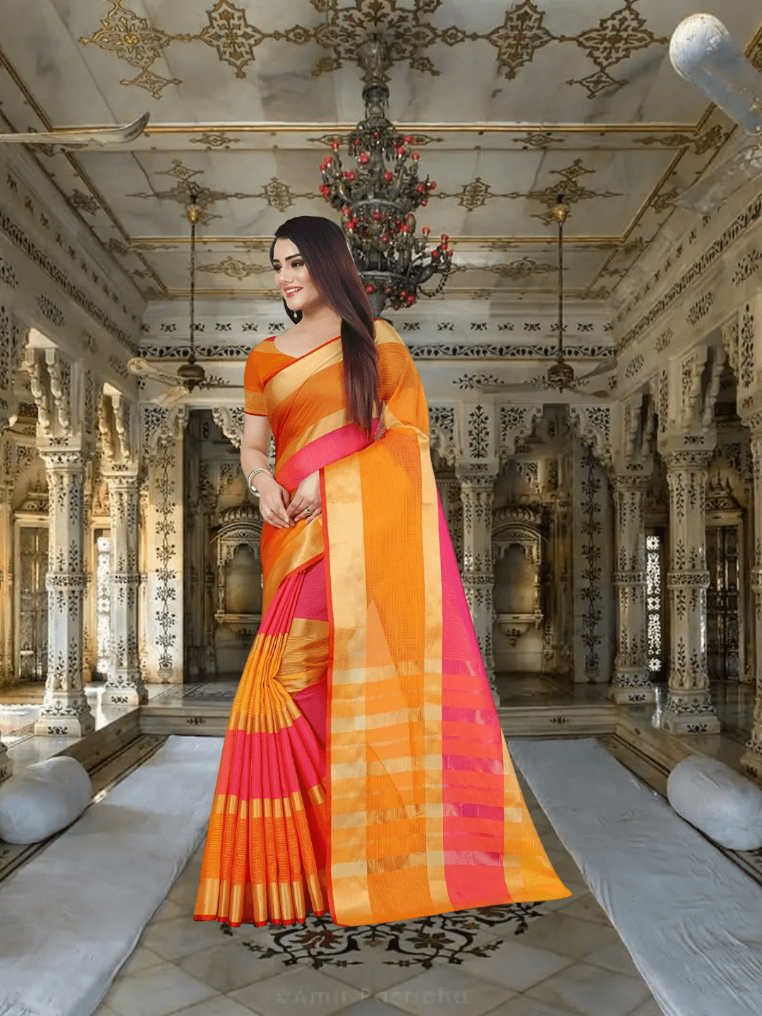 Back view of model walking gracefully, long pallu and zari work shimmering in sun