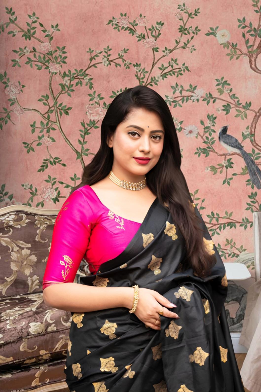 Front view of black silk saree with pink blouse in royal setting