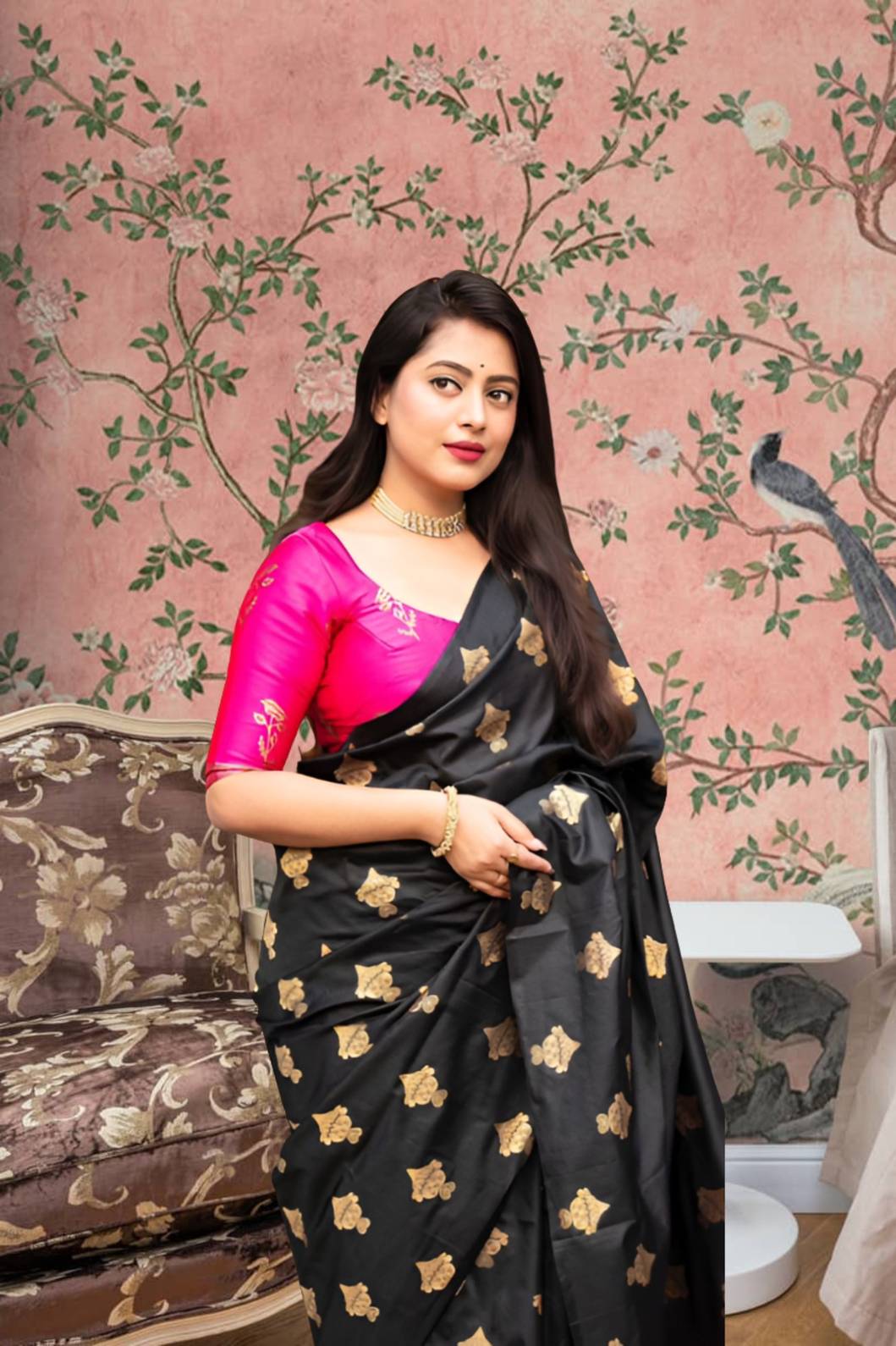Front view of black silk saree with pink blouse in royal setting