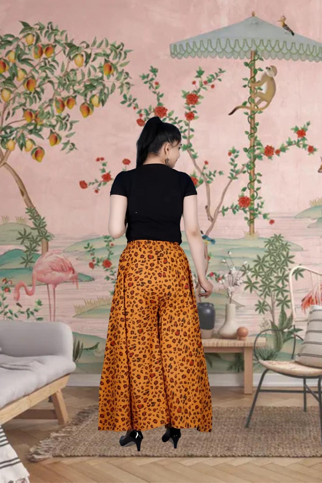 Rear look of orange palazzo, flaring like dusk over sand