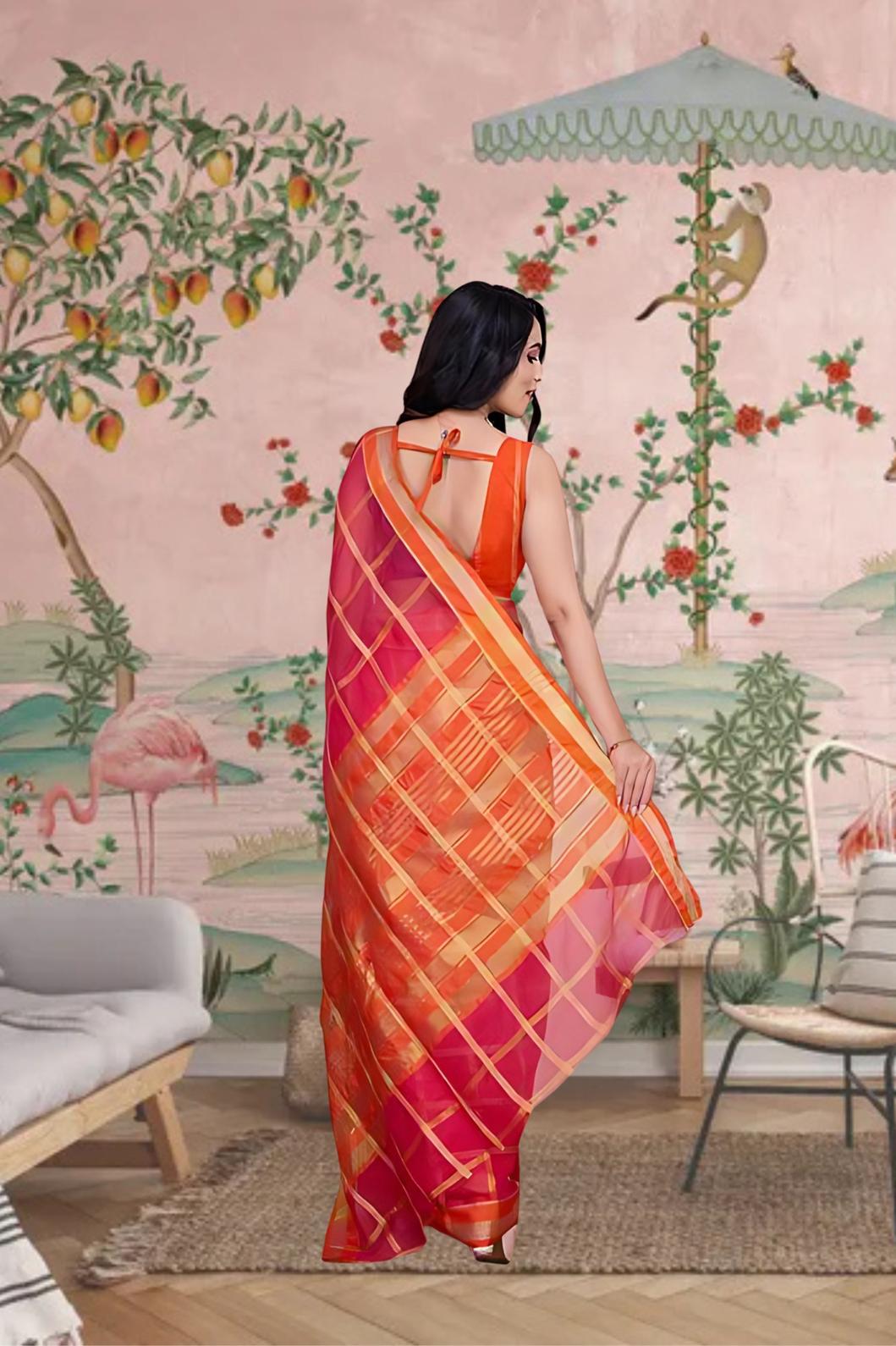 Back profile showing cascading pallu in deep red charm