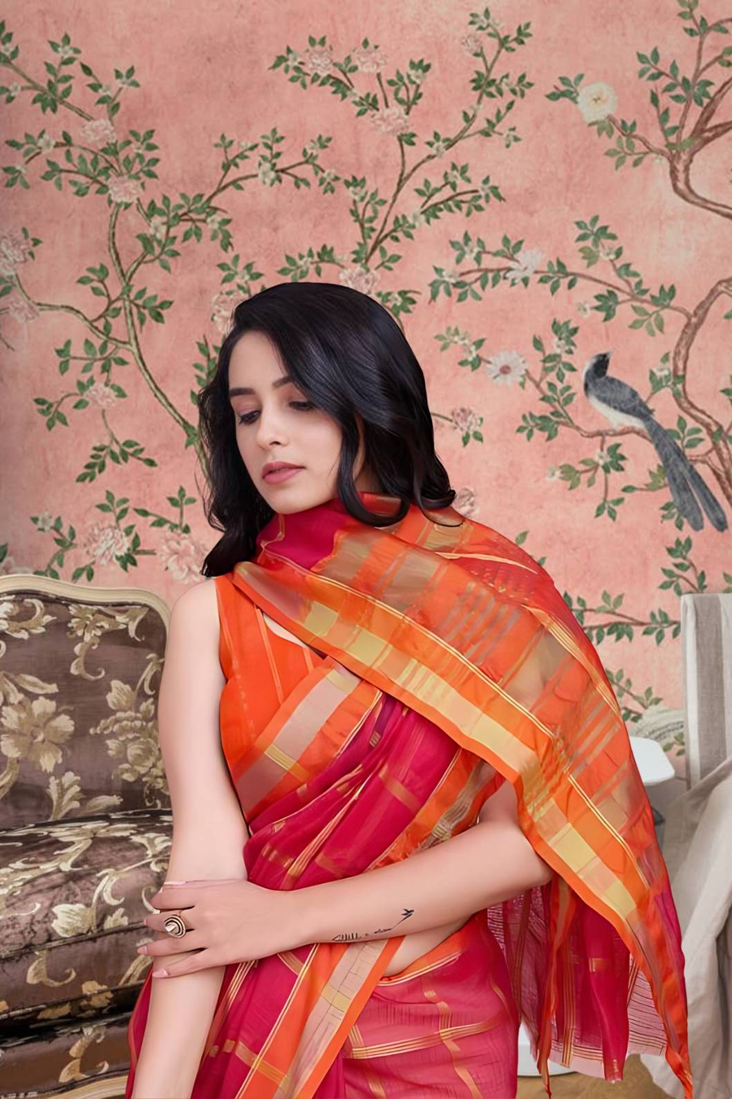 Front view of red checkered saree glowing in palace light