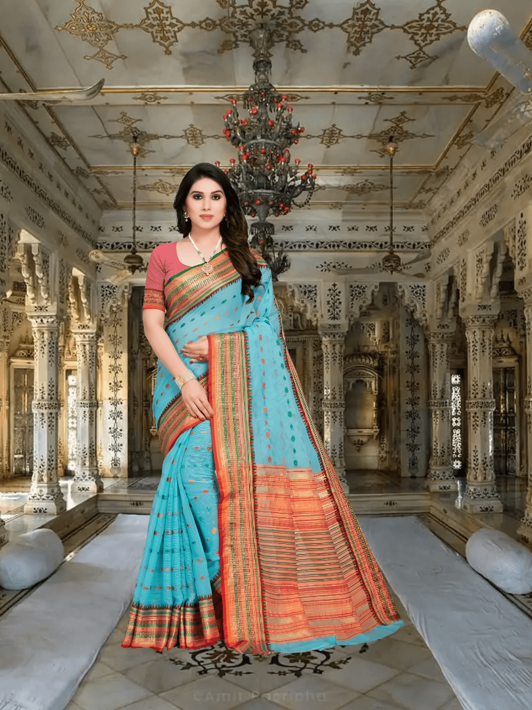 Sky blue Kota Doria saree with dot patterns worn in full front standing pose.