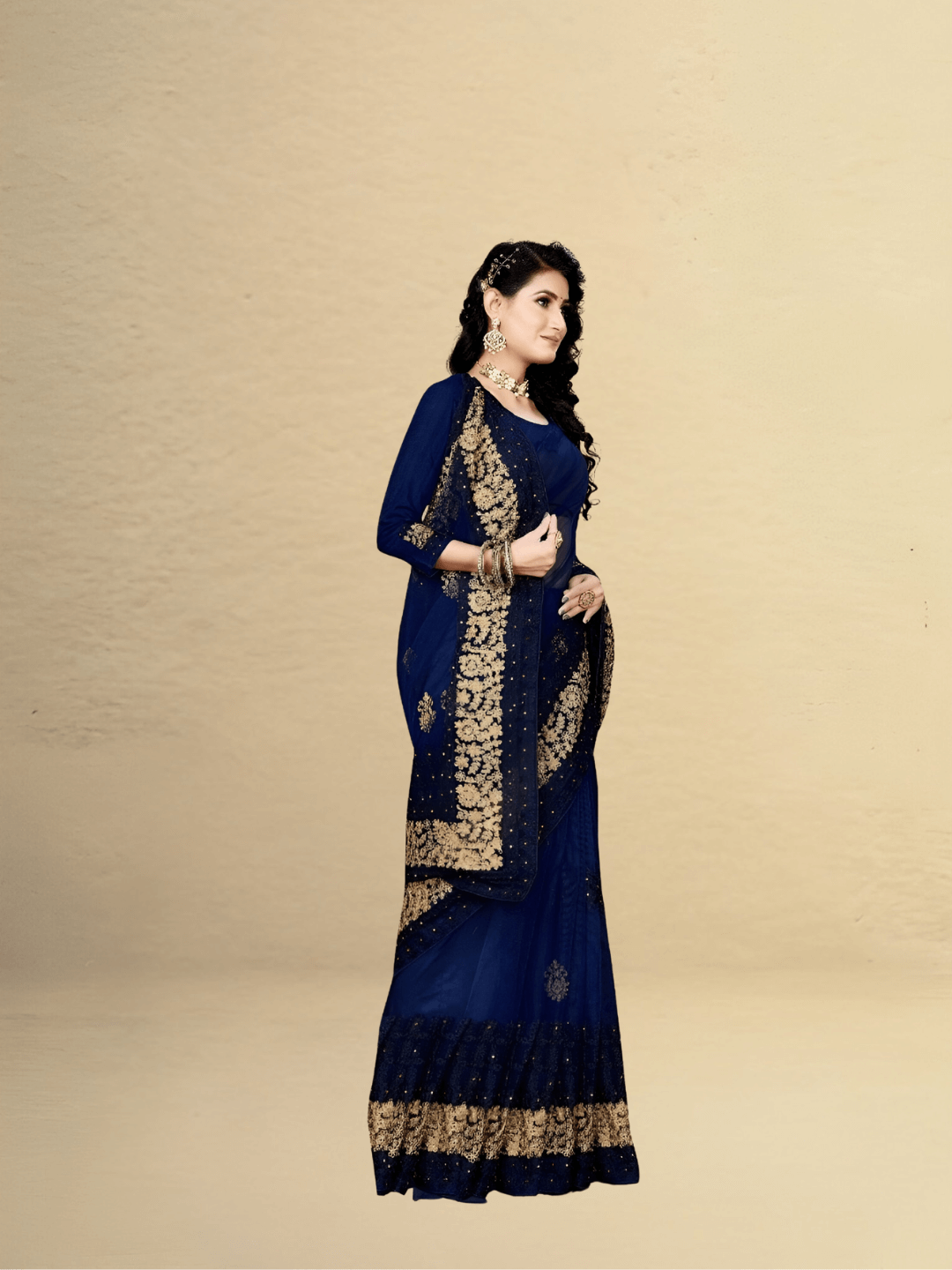 Flat lay of navy netted saree in studio, detailed threadwork catching soft lighting