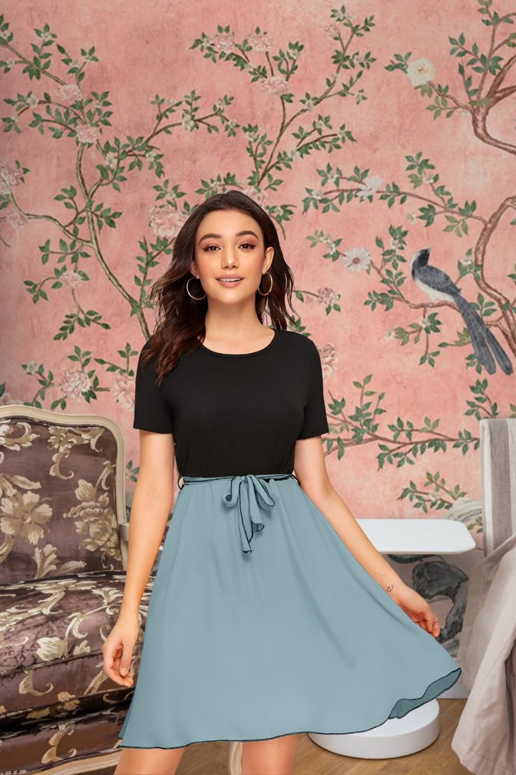 Front view of Monochrome Reverie knit dress in black top and grey skirt