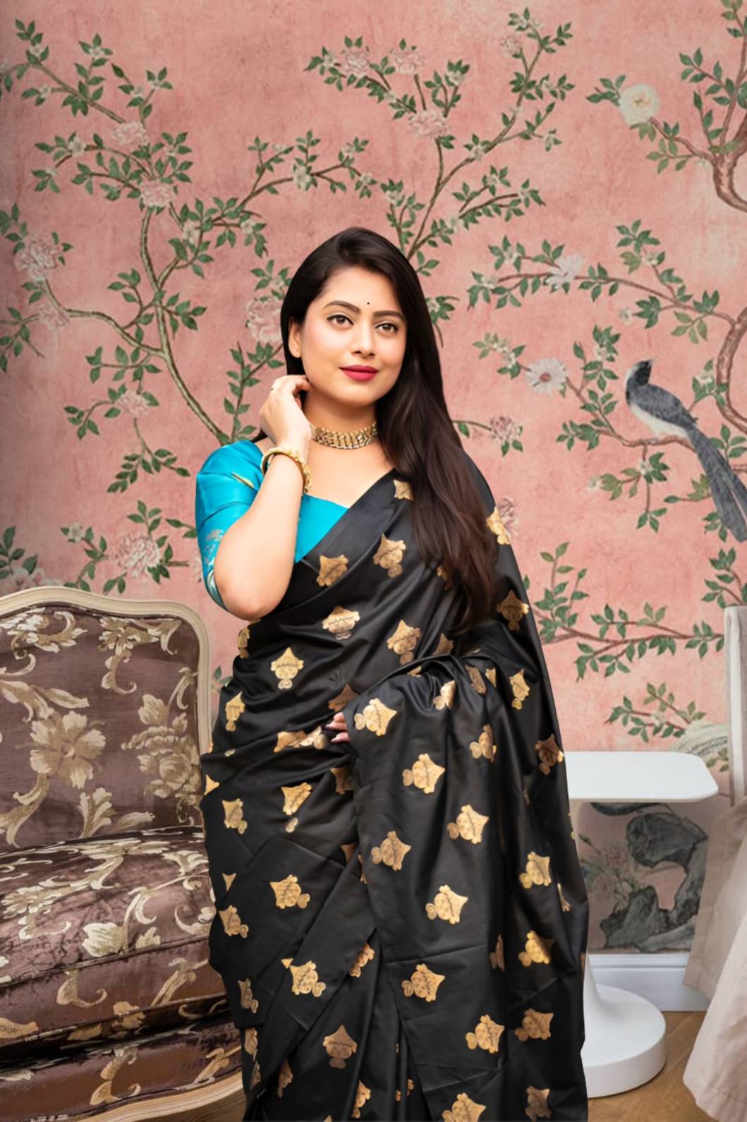 Front view of black silk saree with sky blue blouse in royal setting