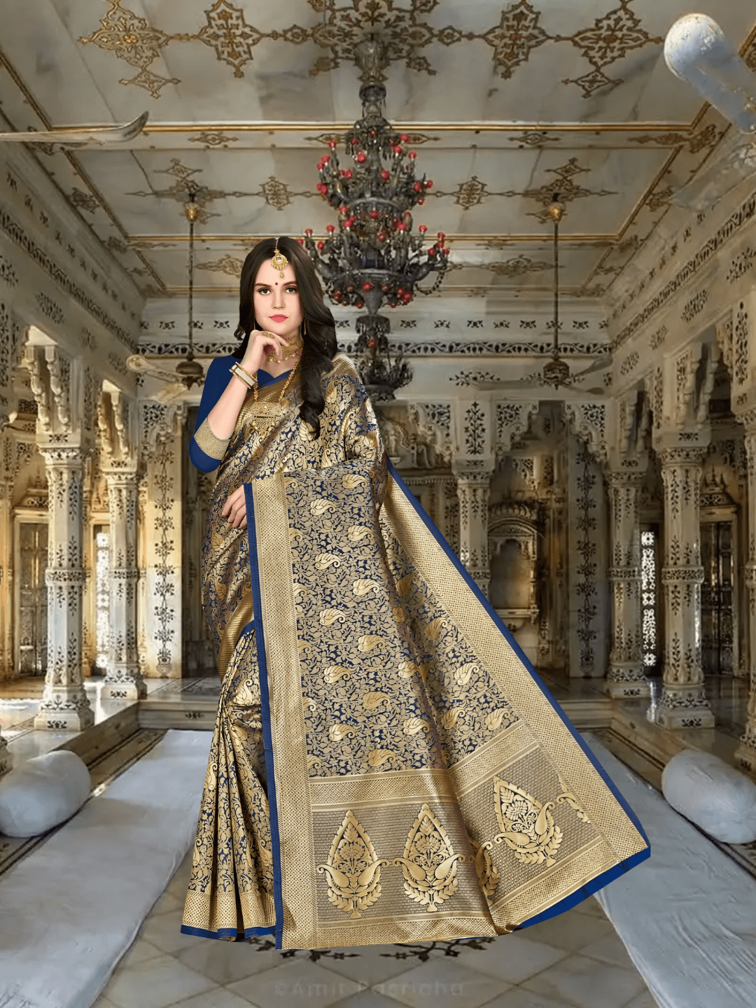 Model in blue Banarasi silk saree with golden motifs in royal palace setting
