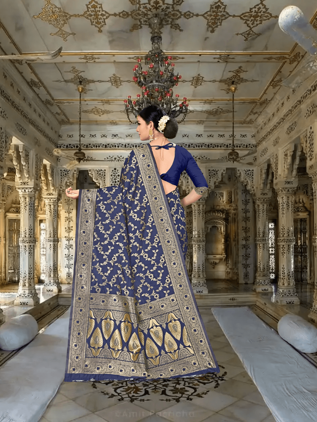 Close-up of gold motifs on navy silk blend fabric with royal décor