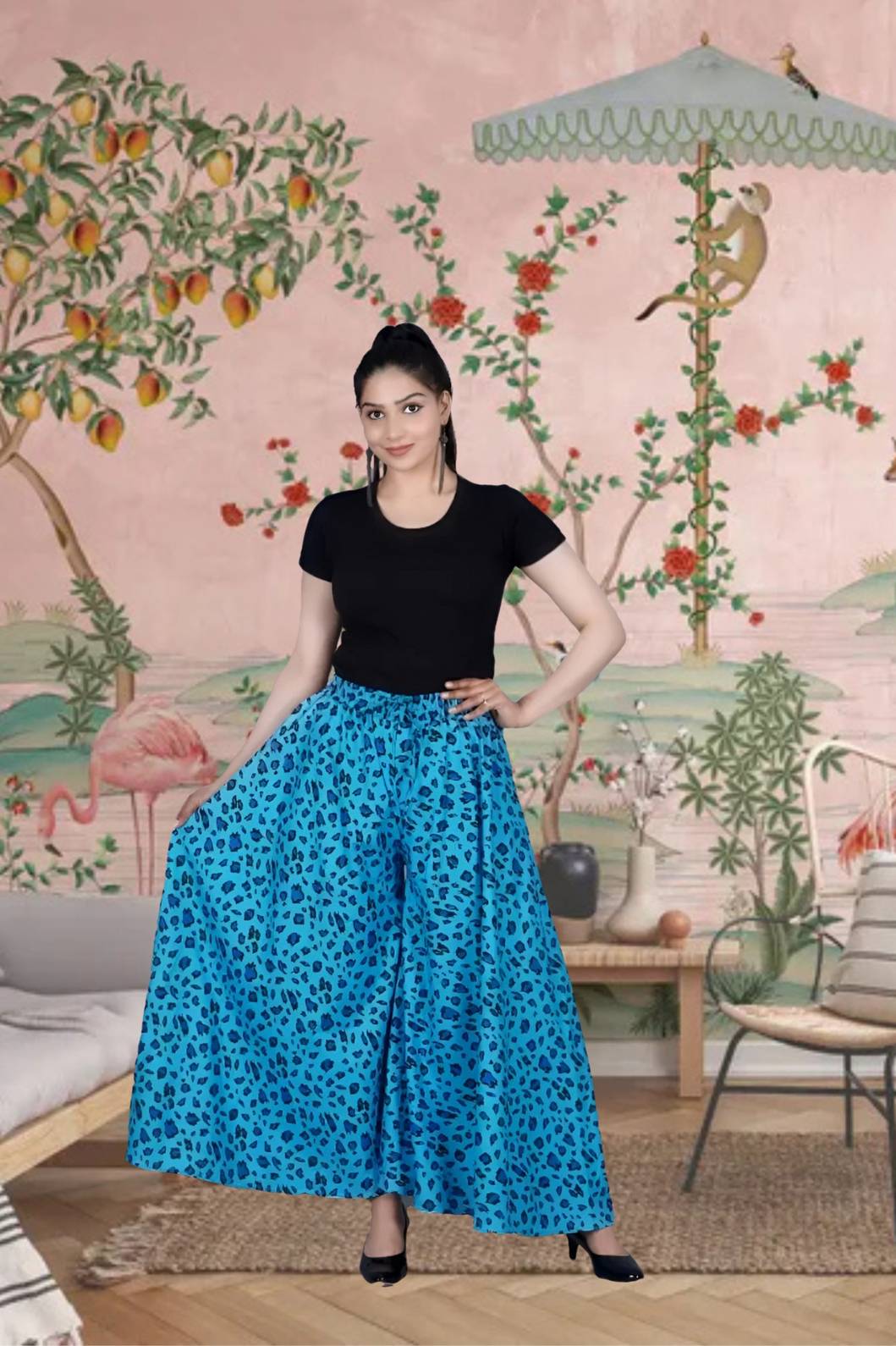 Front view of light blue cotton palazzo pants in palace backdrop