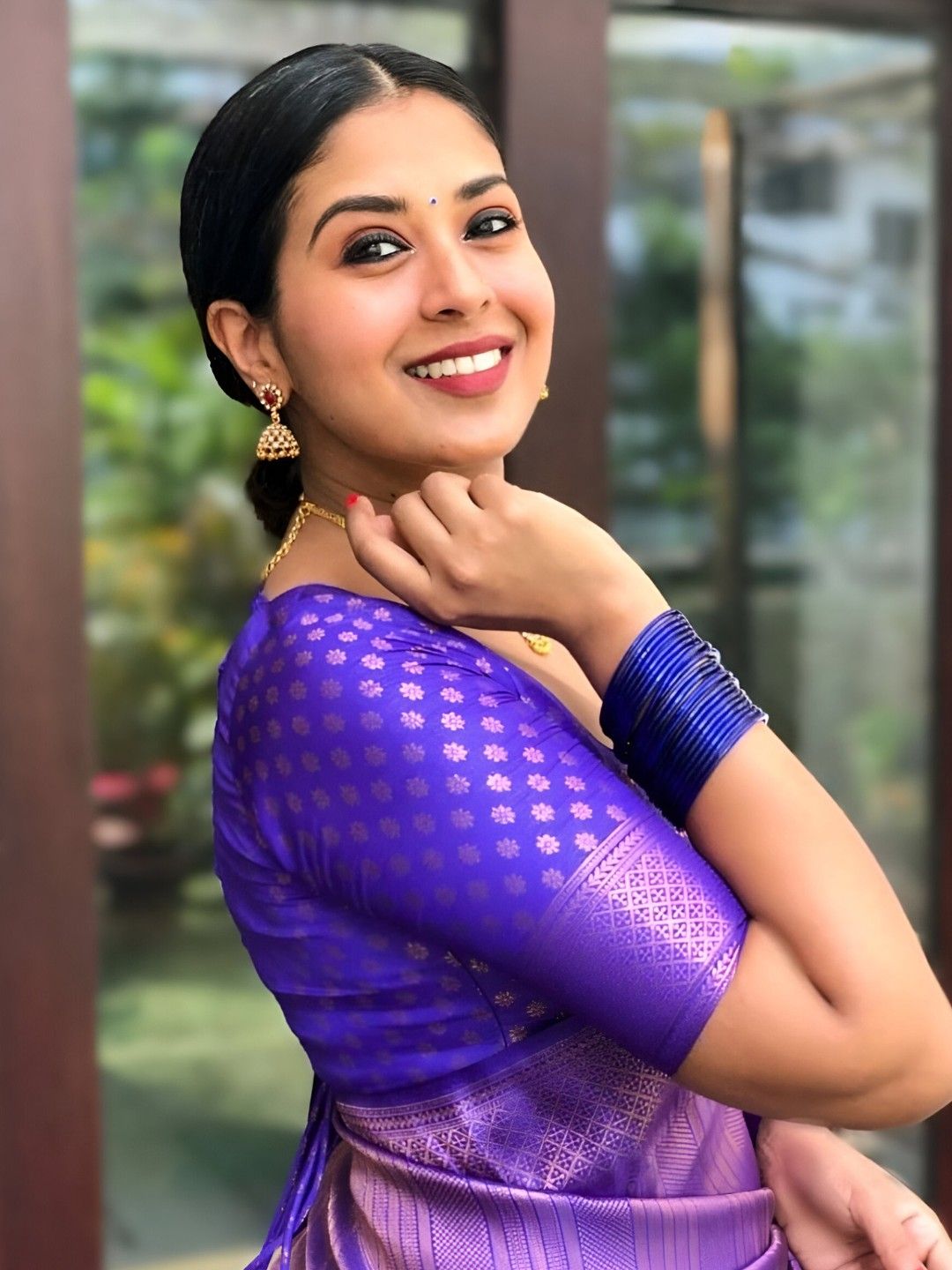 Model standing with riverside poise