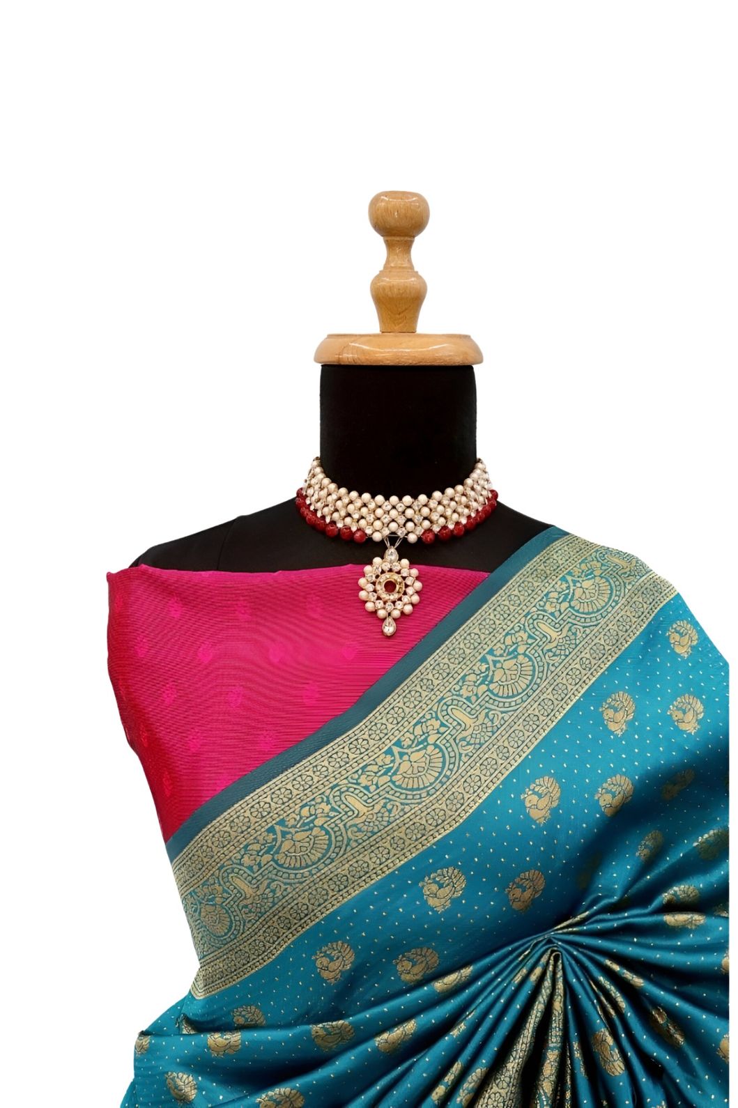 Studio closeup of silk richness and gold detailing – white background