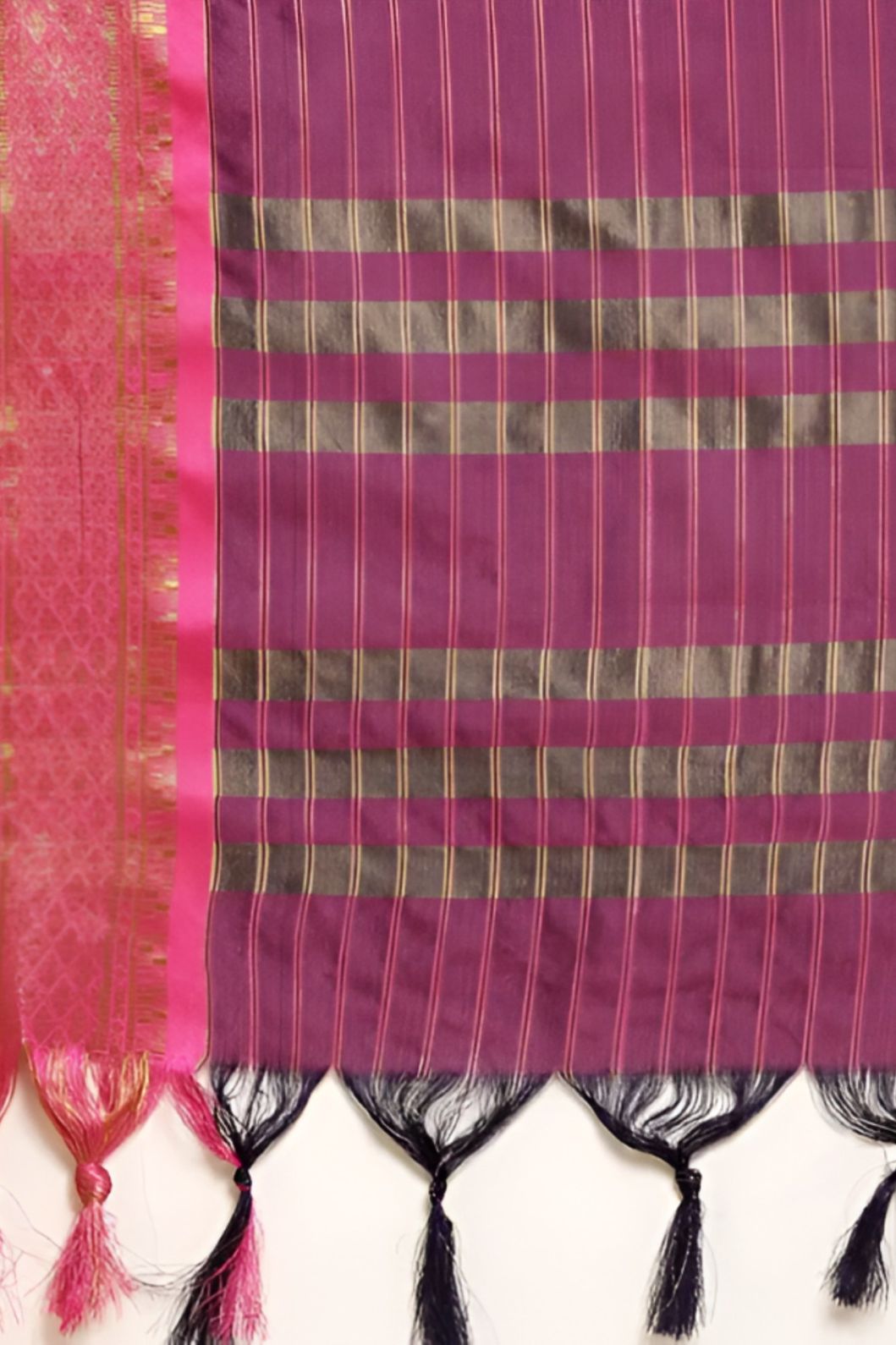 Studio close-up of navy checkered pallu and gold edge glint